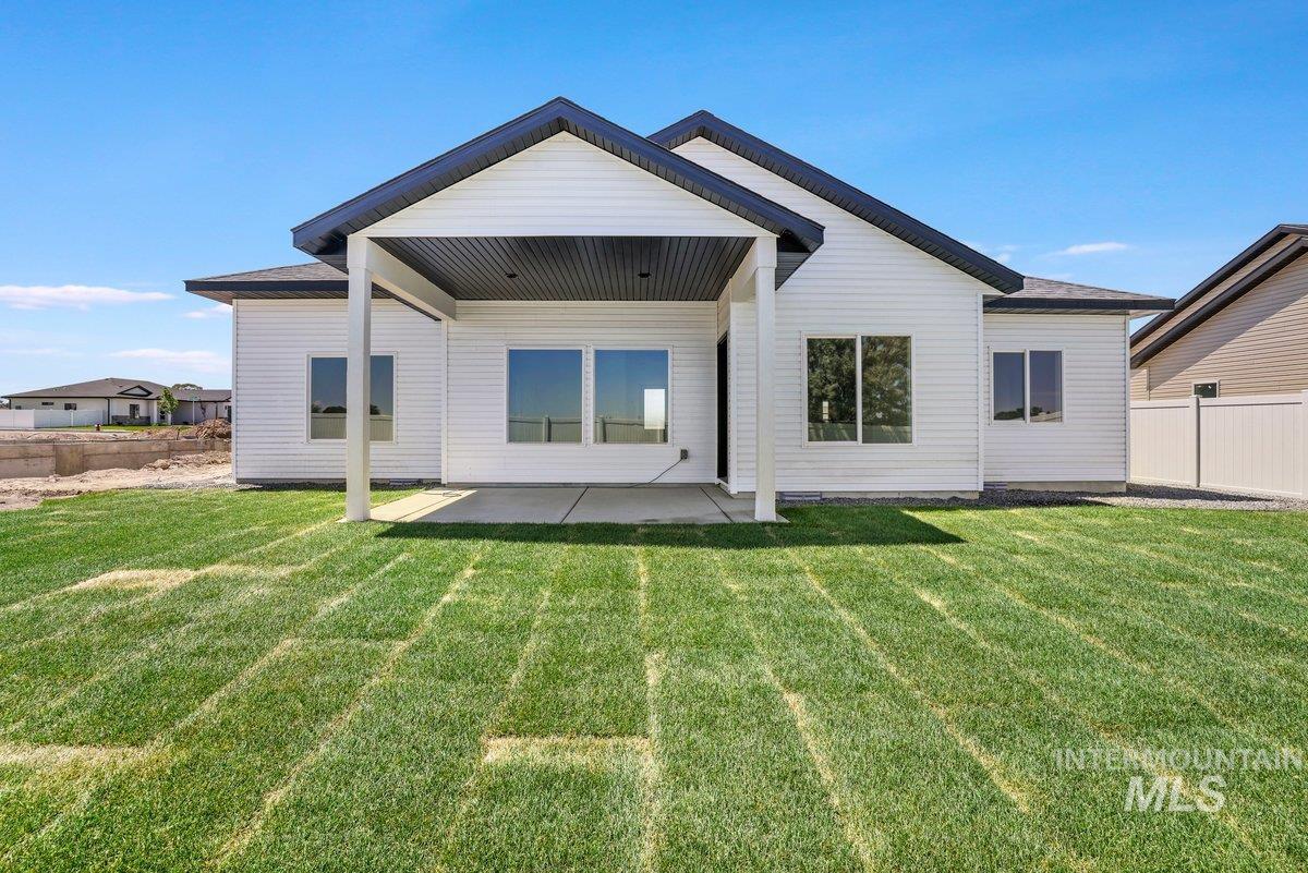 Rear view of house featuring a patio area