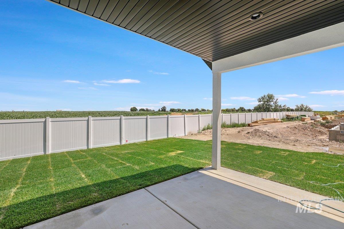 Fenced backyard with a patio area