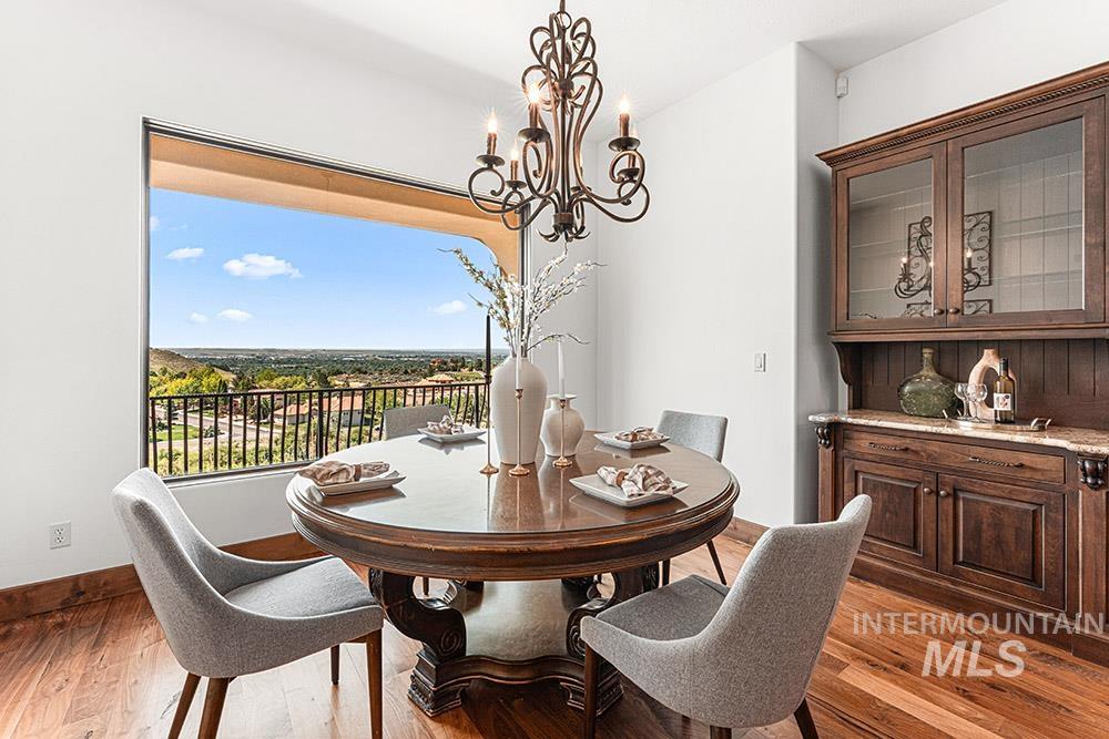 Dining area with a chandelier and wood finished floors