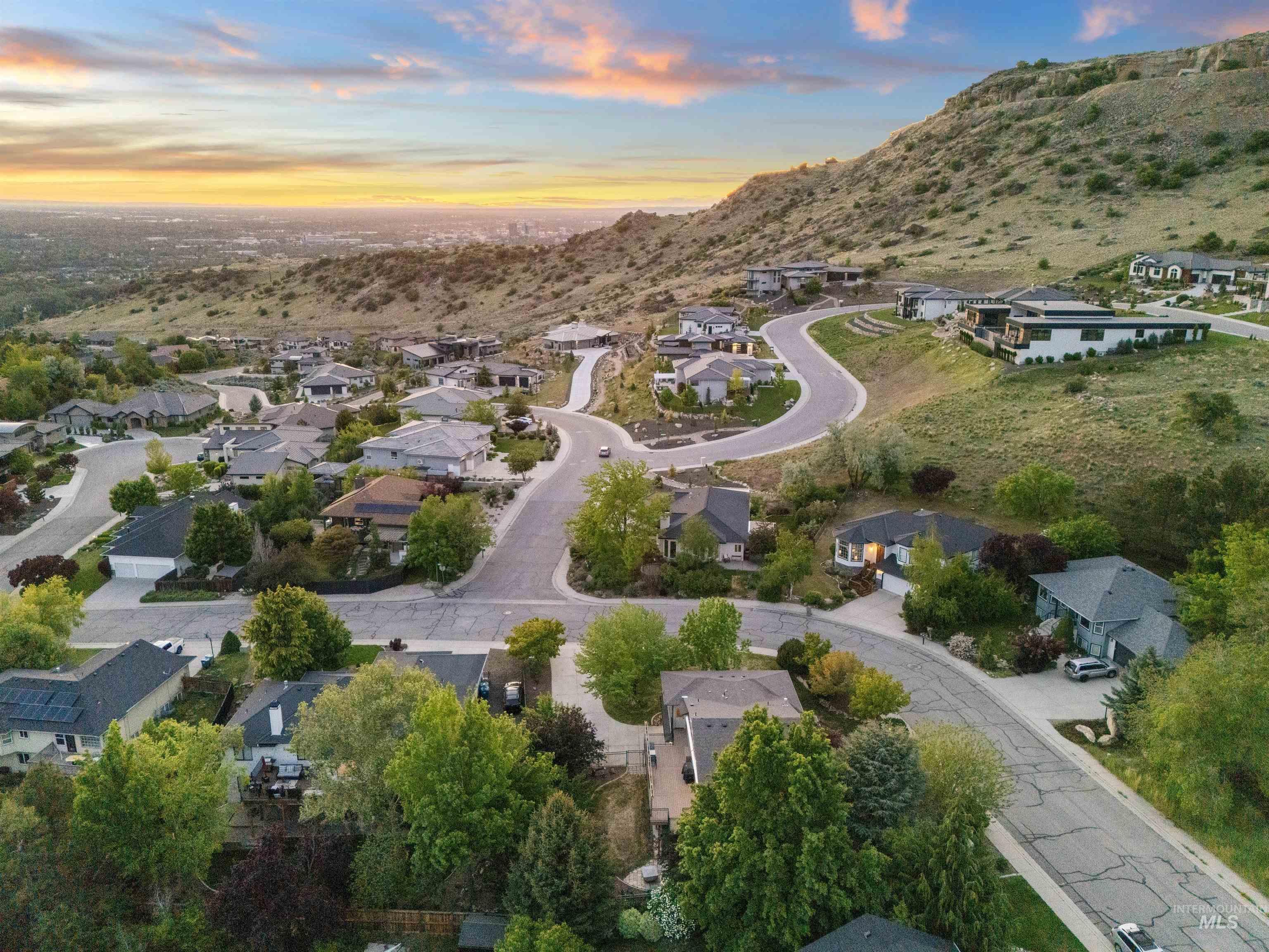 Aerial view at dusk of a residential view and a mountain view