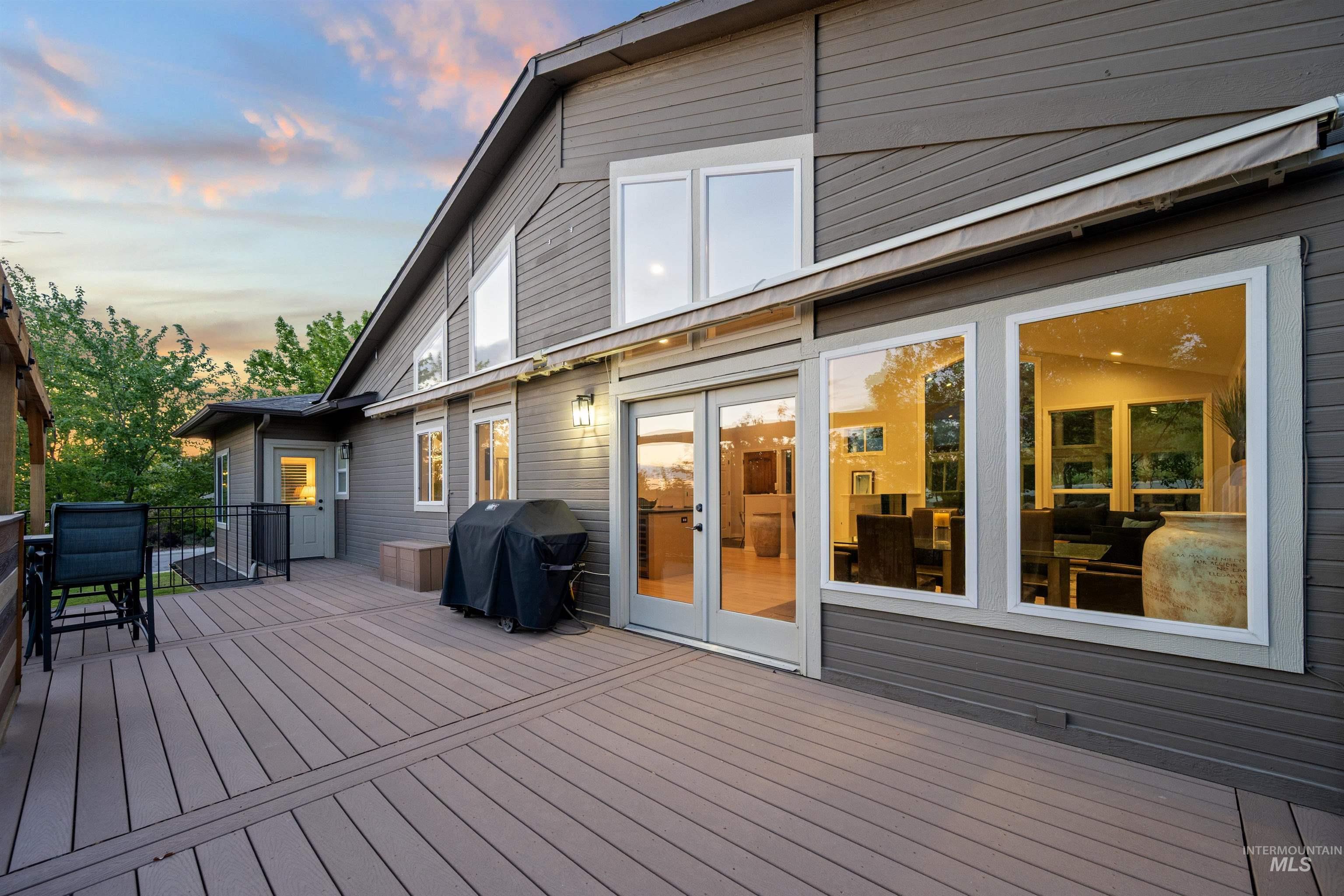 Deck at dusk with area for grilling