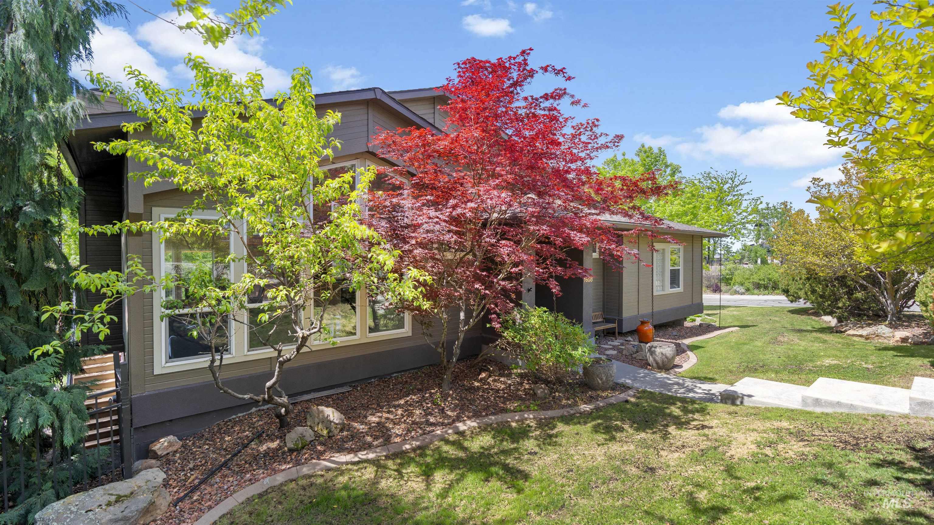 View of side of property with a yard