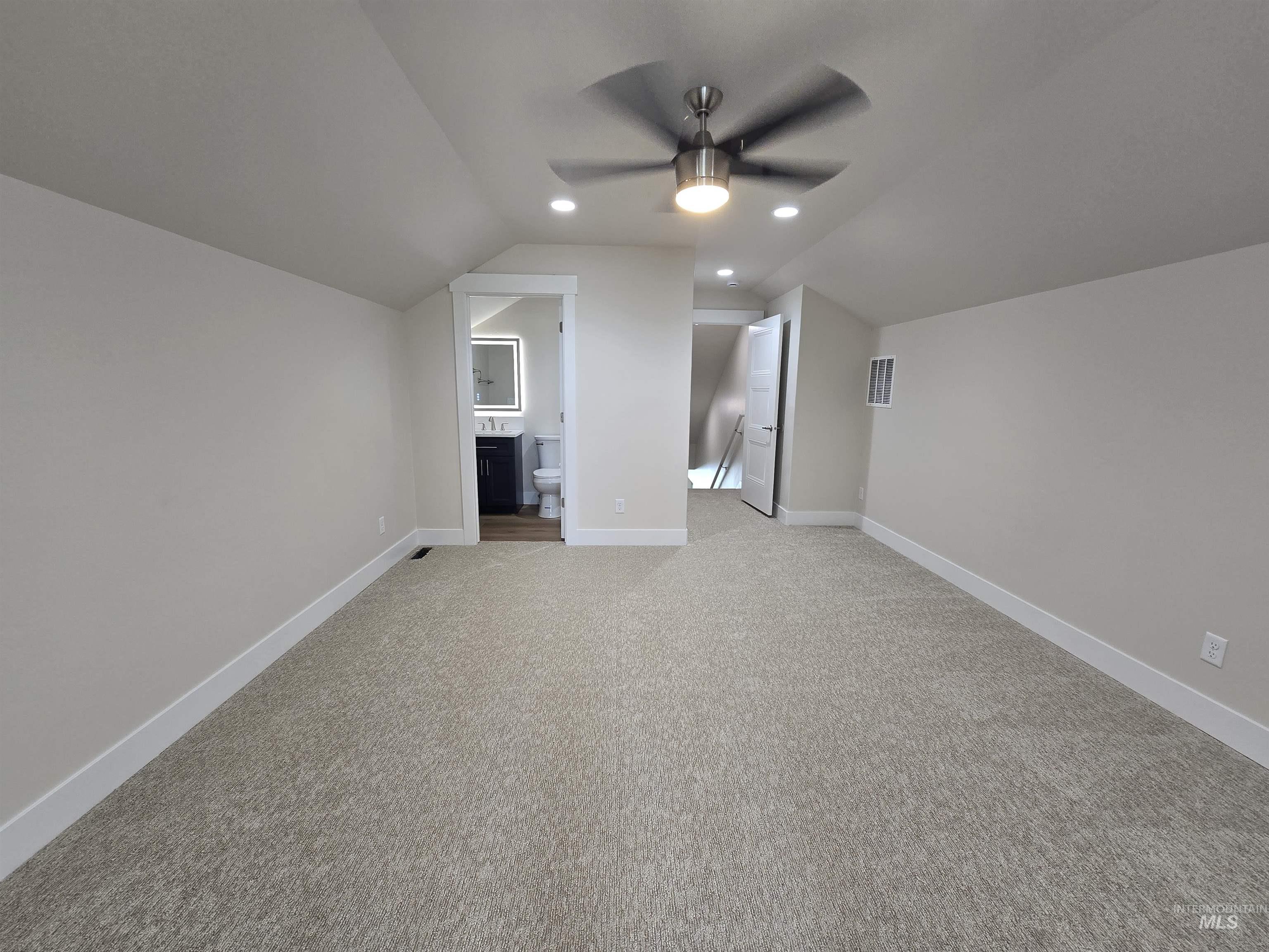 Bonus room with a ceiling fan, light colored carpet, vaulted ceiling, and recessed lighting