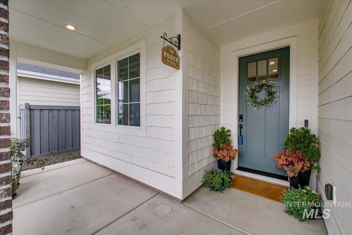 Entrance to property featuring covered porch