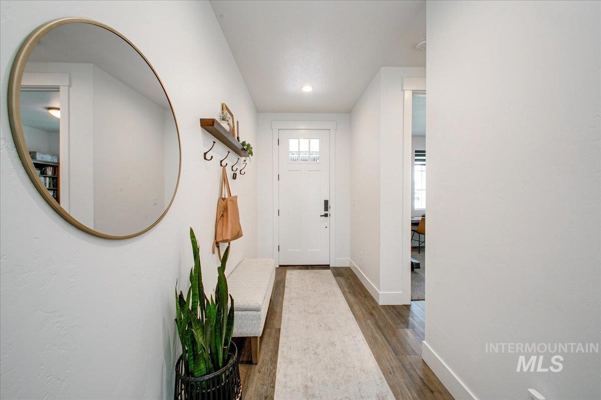 Foyer featuring wood finished floors and recessed lighting