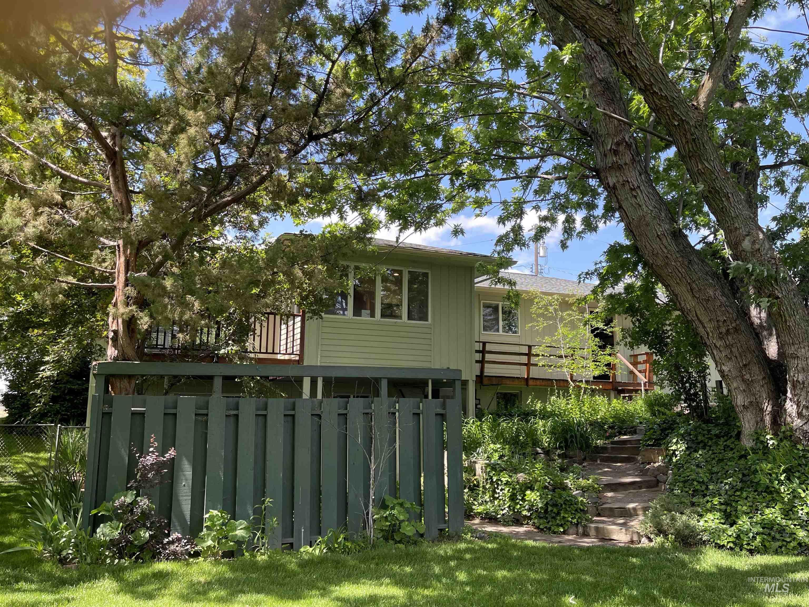 Photo of dining room over looking the lush backyard