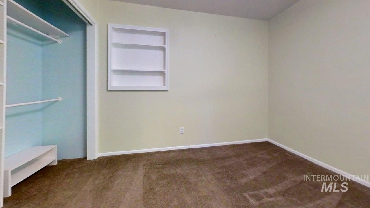 Unfurnished bedroom featuring carpet flooring