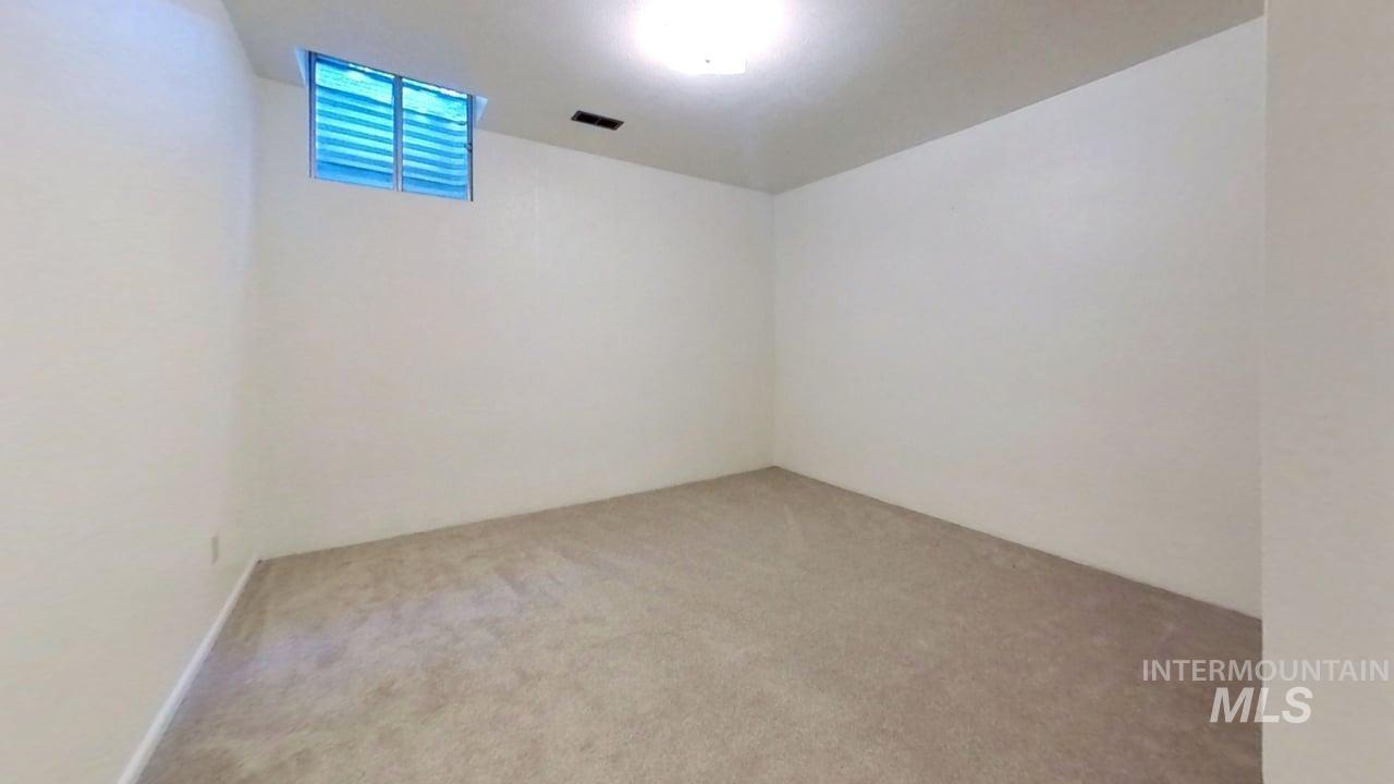 Empty room featuring carpet