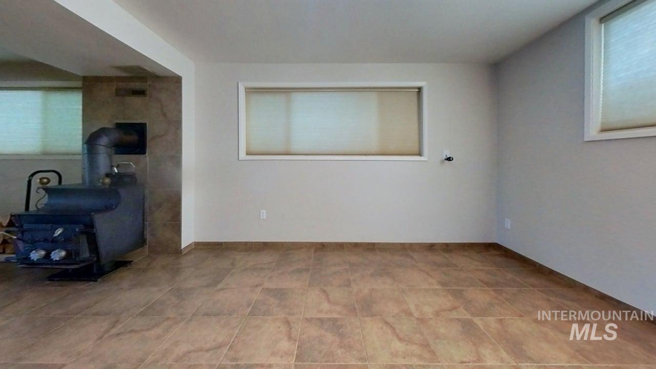 Daylight basement, with wet bat and cozy wood stove.