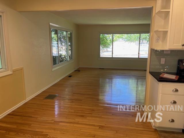 Unfurnished dining area with plenty of natural light and light wood finished floors