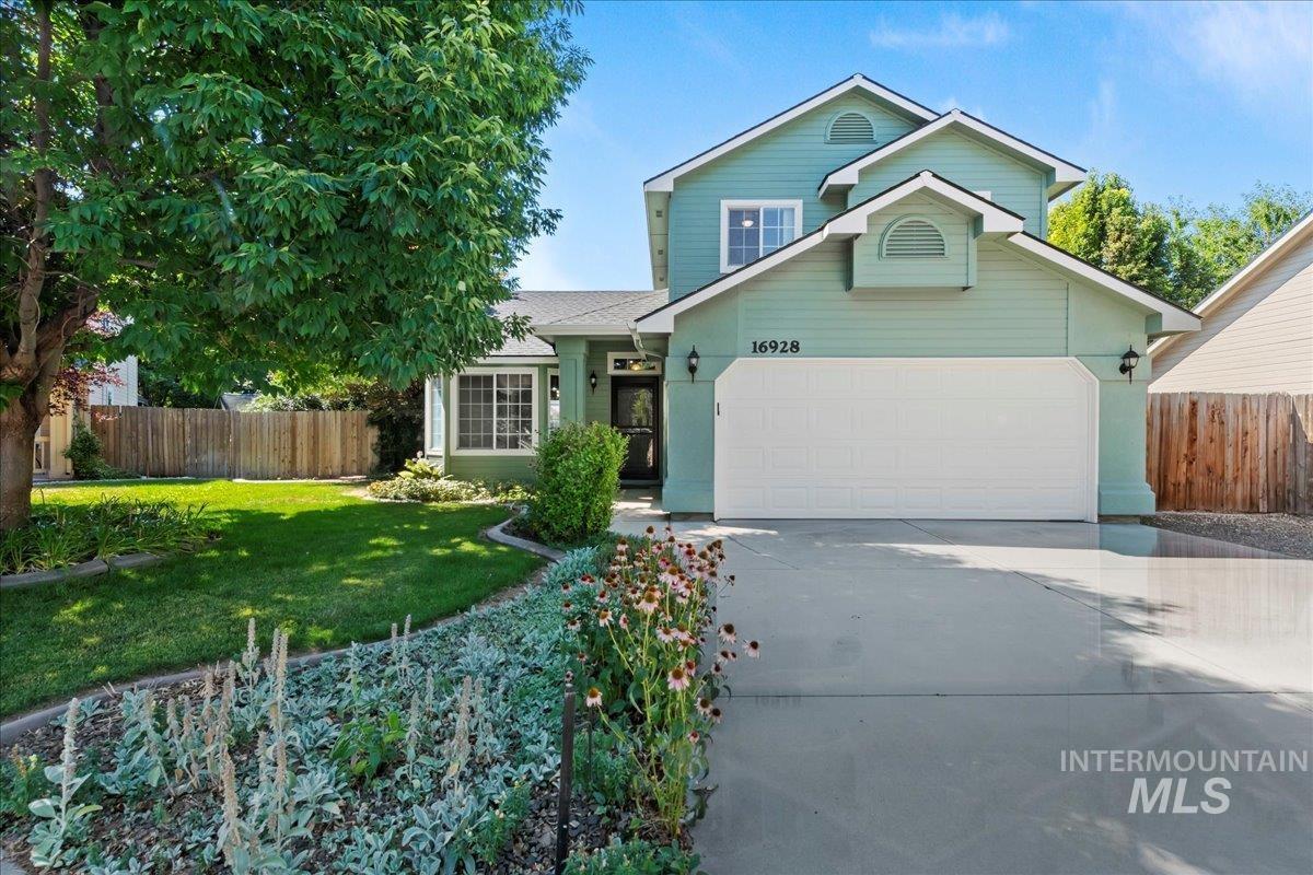 Traditional-style home featuring driveway