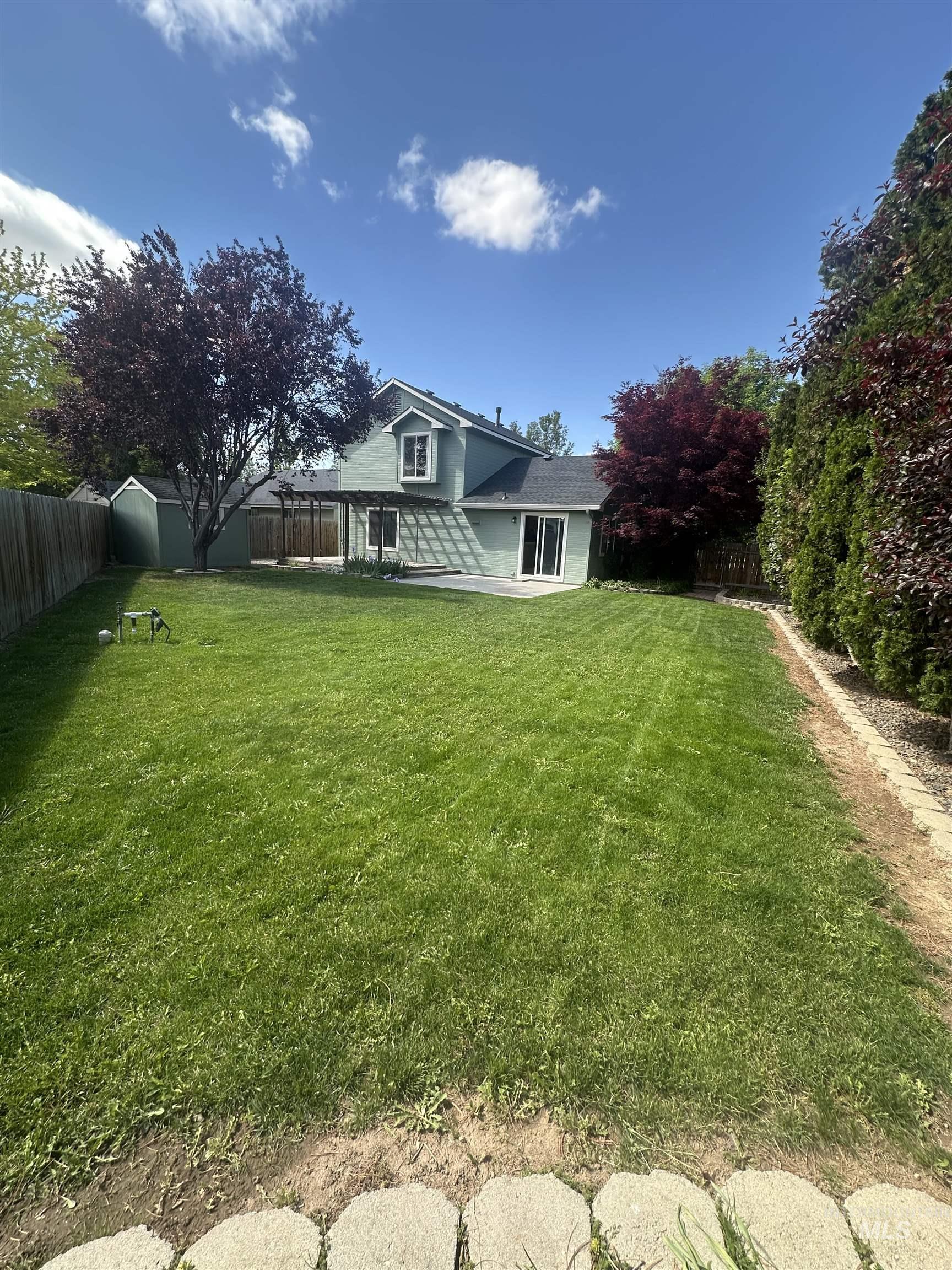 View of fenced backyard