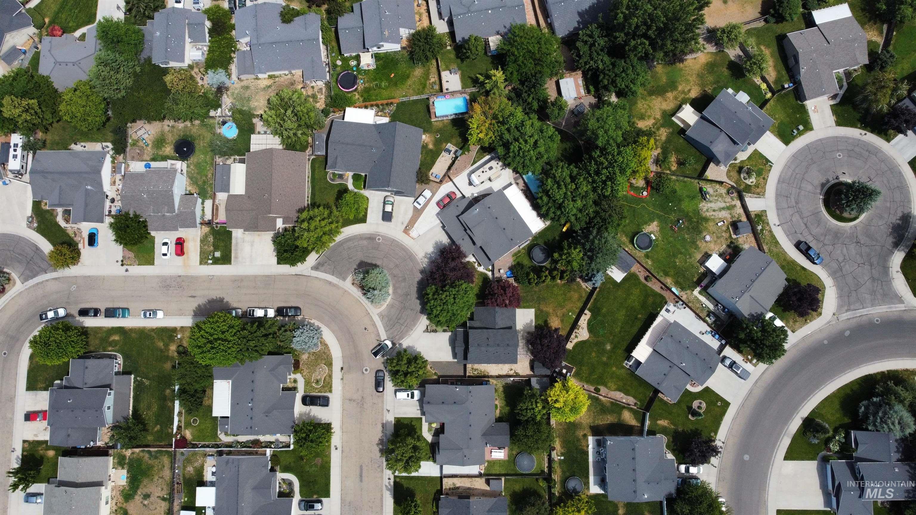 Aerial overview of property's location with nearby suburban area