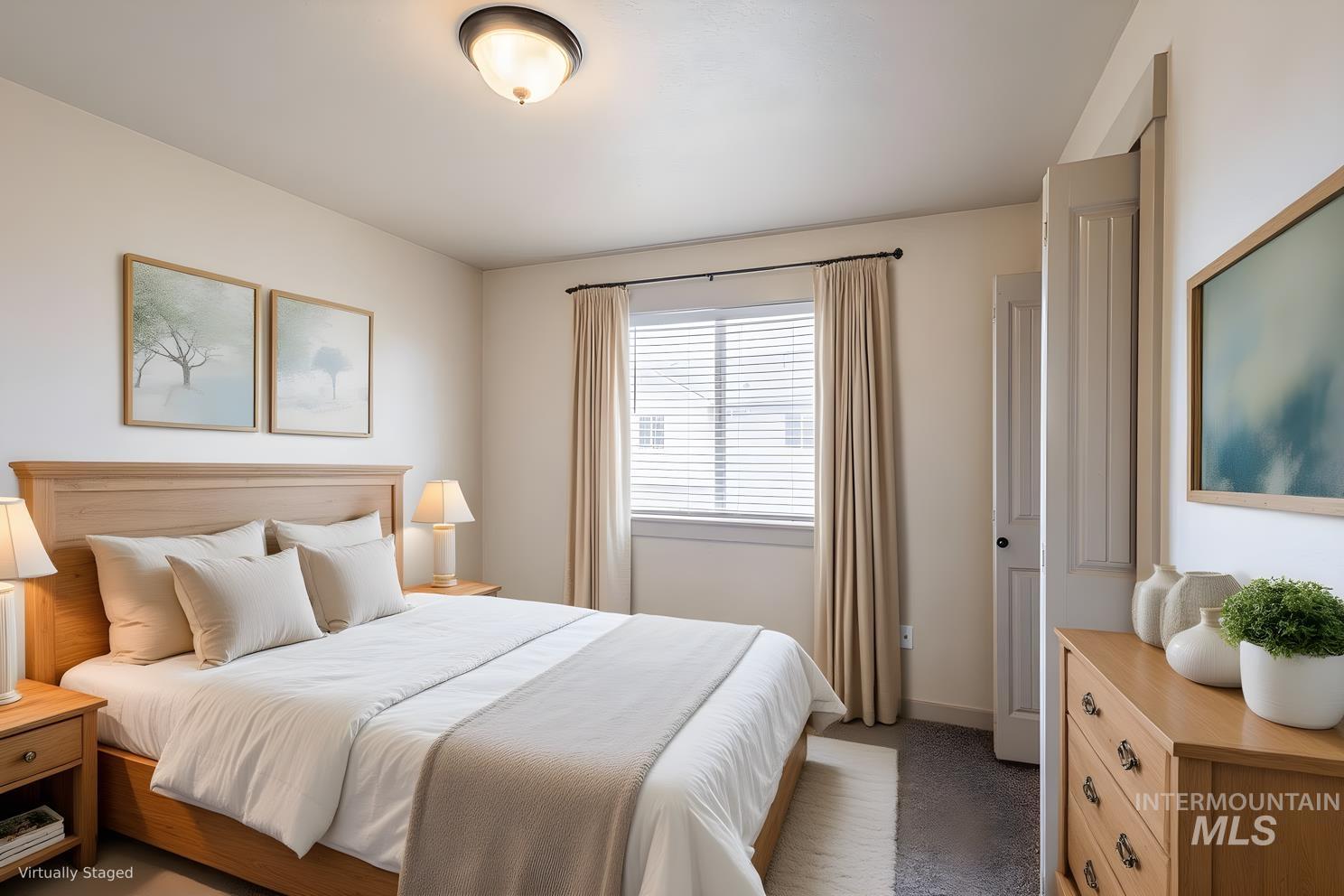 Bedroom with dark colored carpet and baseboards
