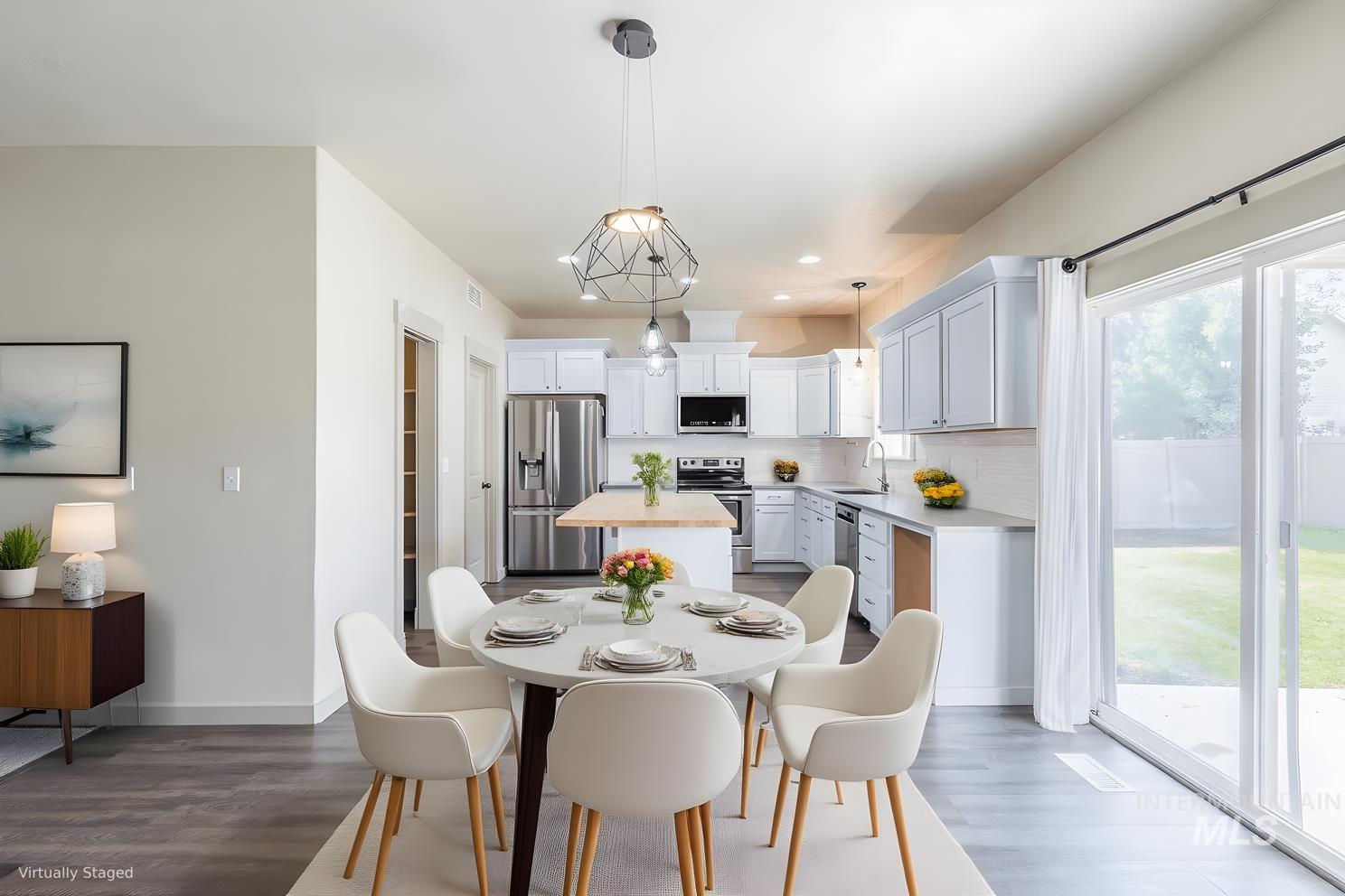 Dining space with light wood finished floors and recessed lighting