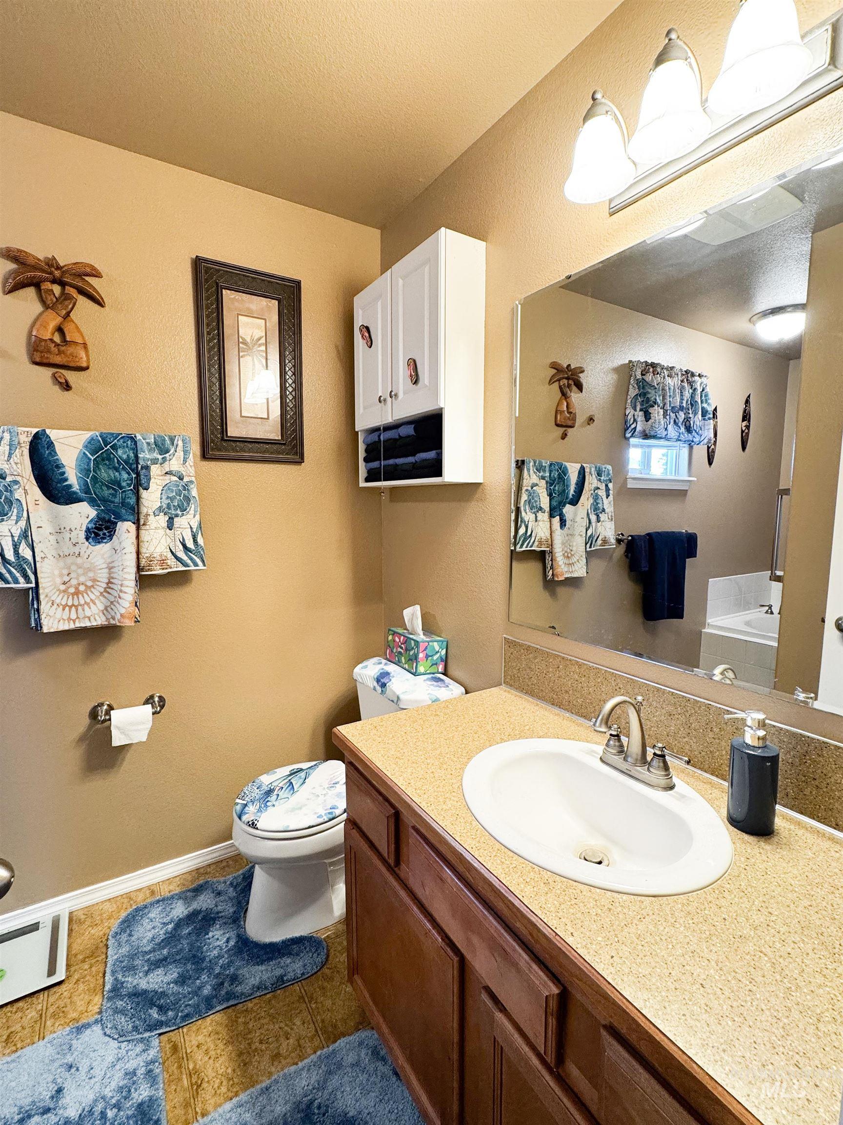 Bathroom with vanity and tile patterned flooring