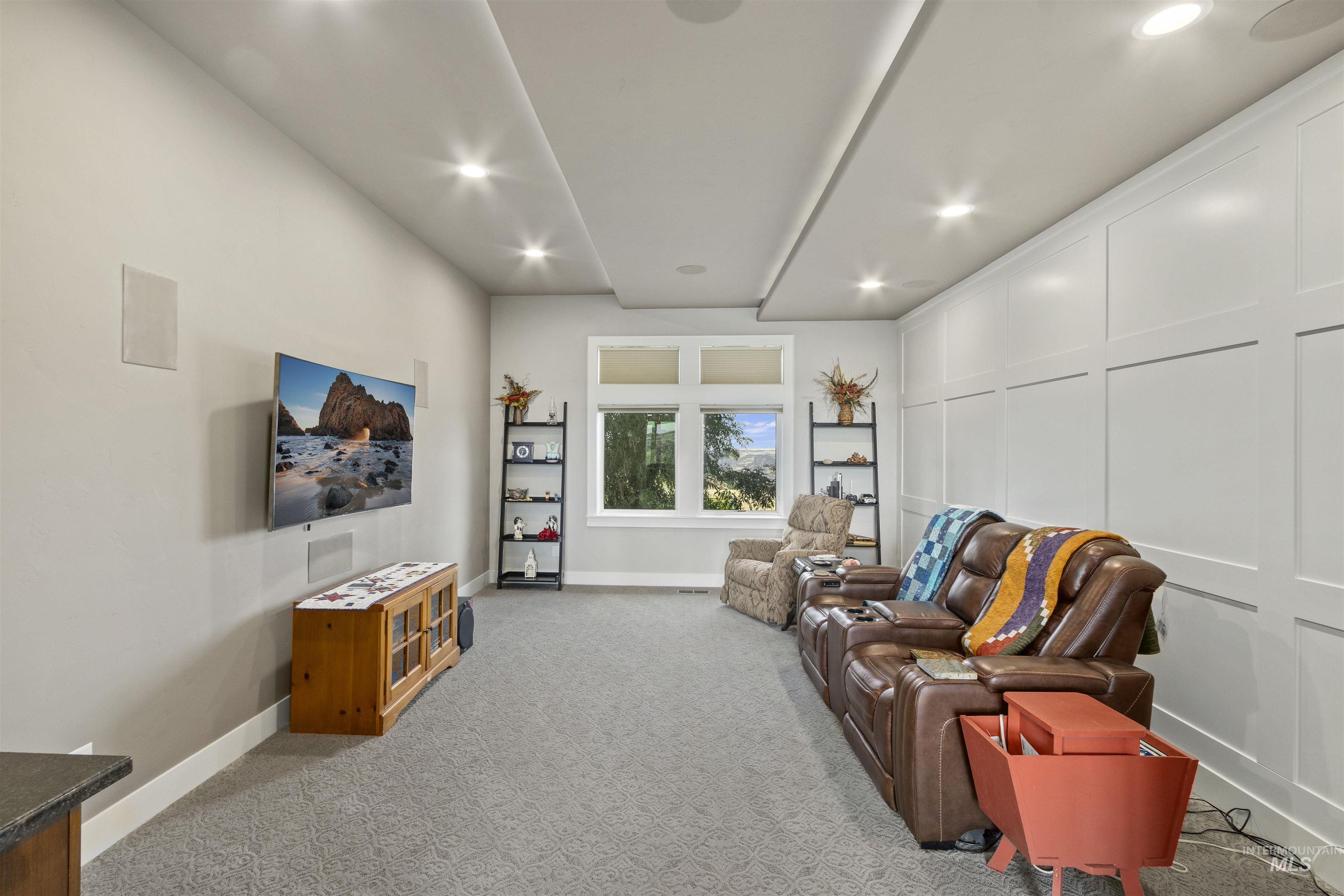 Media room with recessed lighting and canyon views
