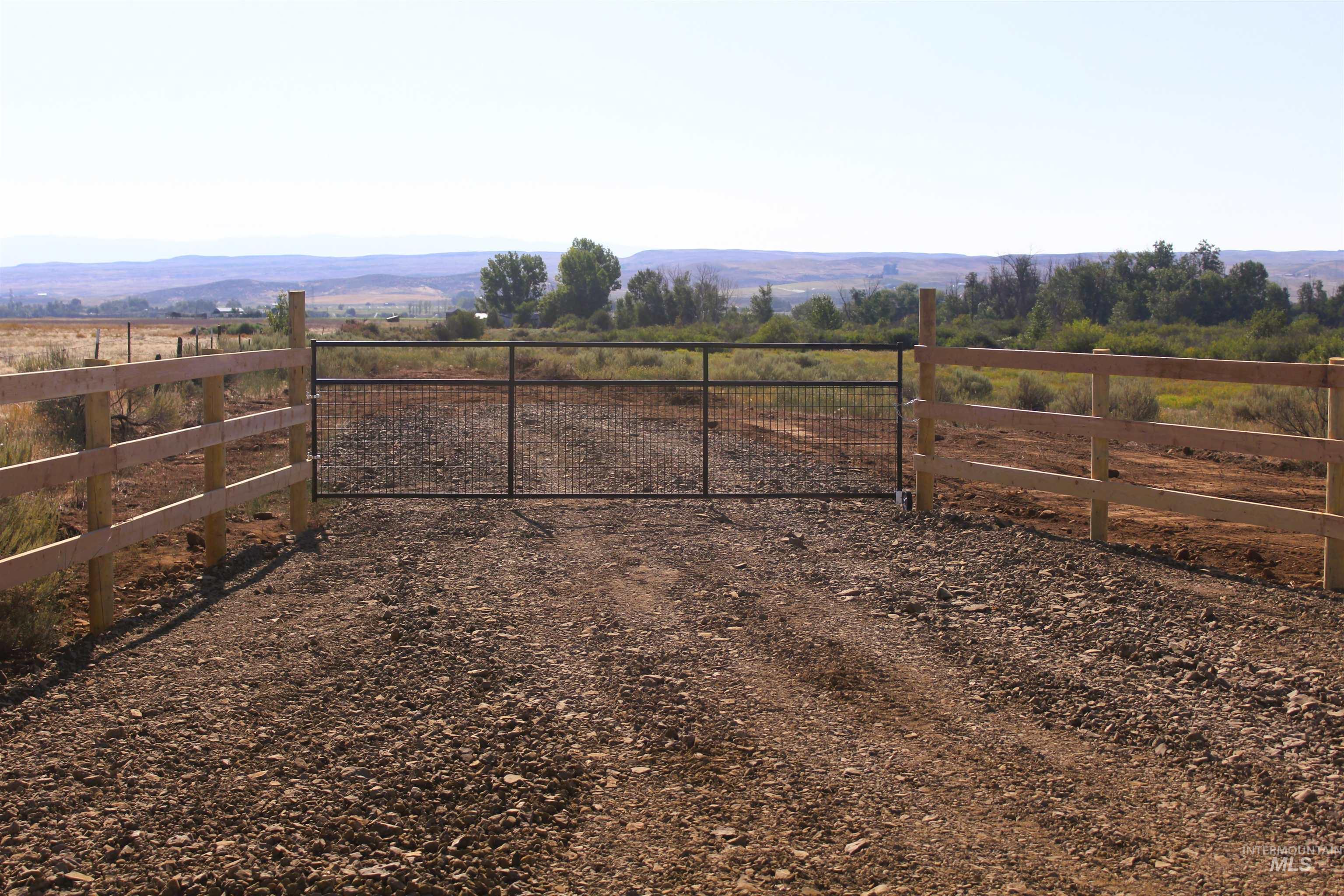 View of yard featuring a gate and a rural view