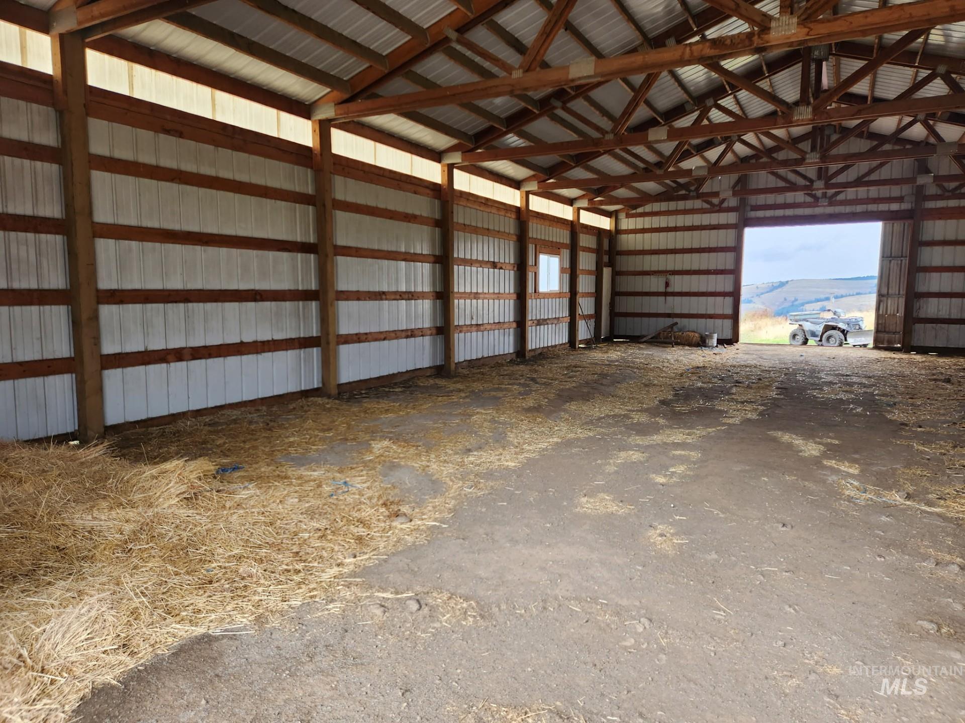 Garage featuring metal wall and a mountain view