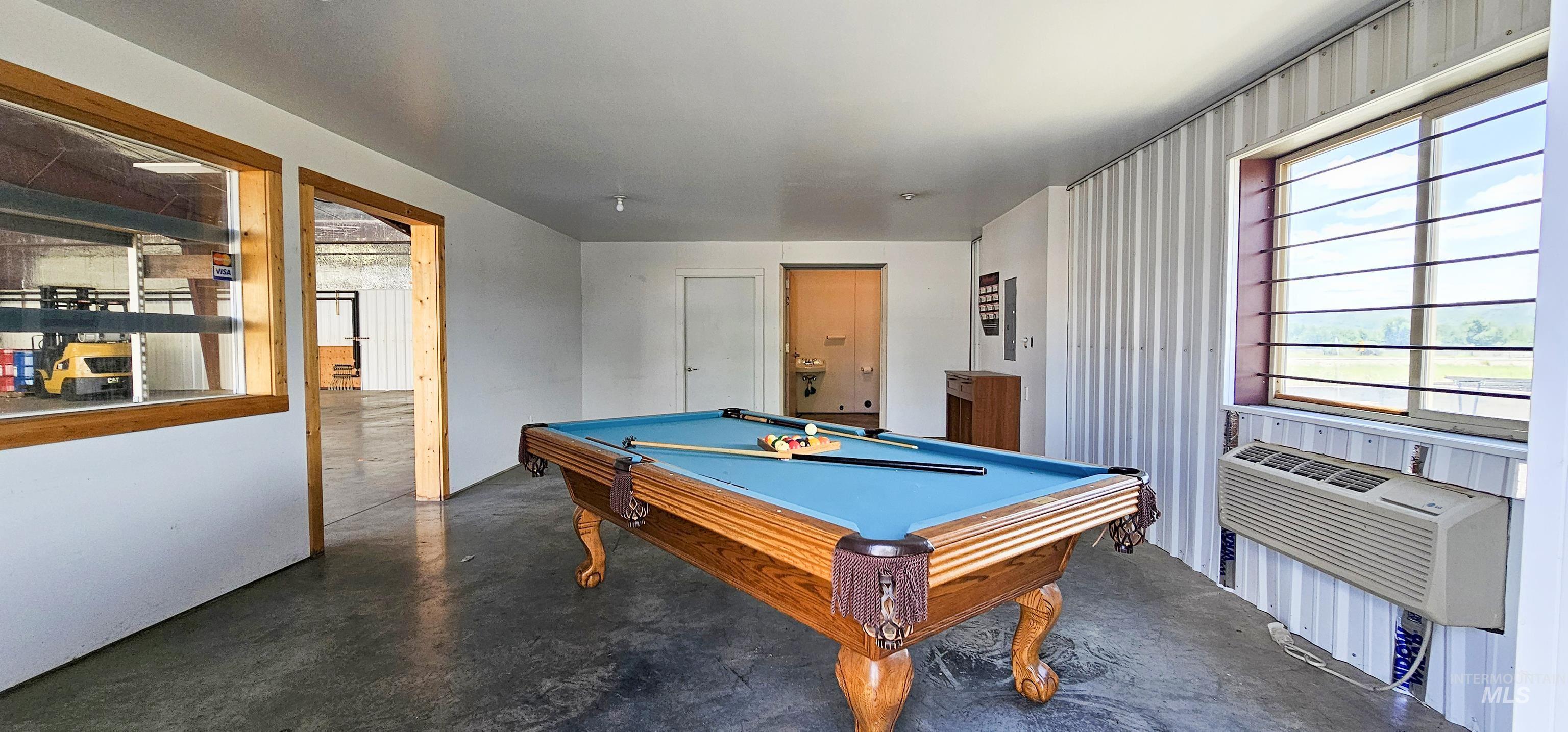 Recreation room featuring concrete floors and pool table