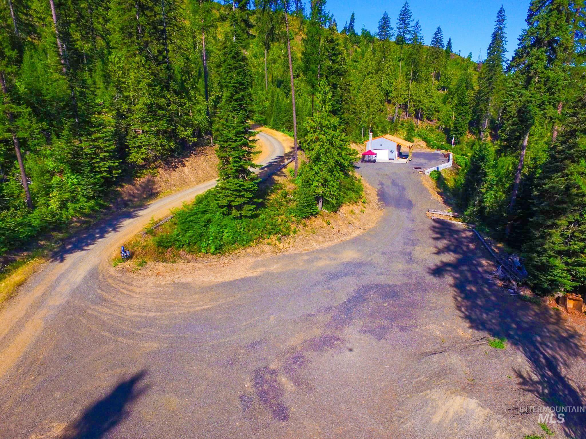 View from above of property featuring a forest