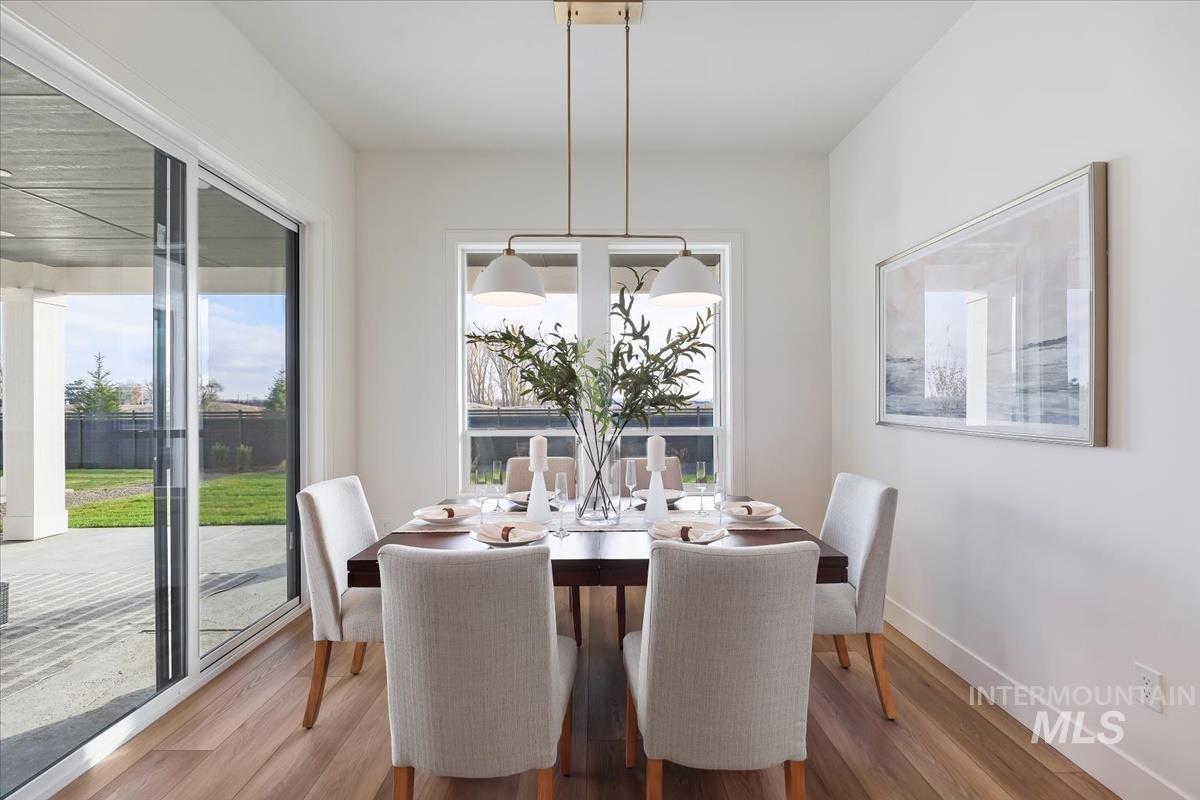 Dining area featuring wood finished floors