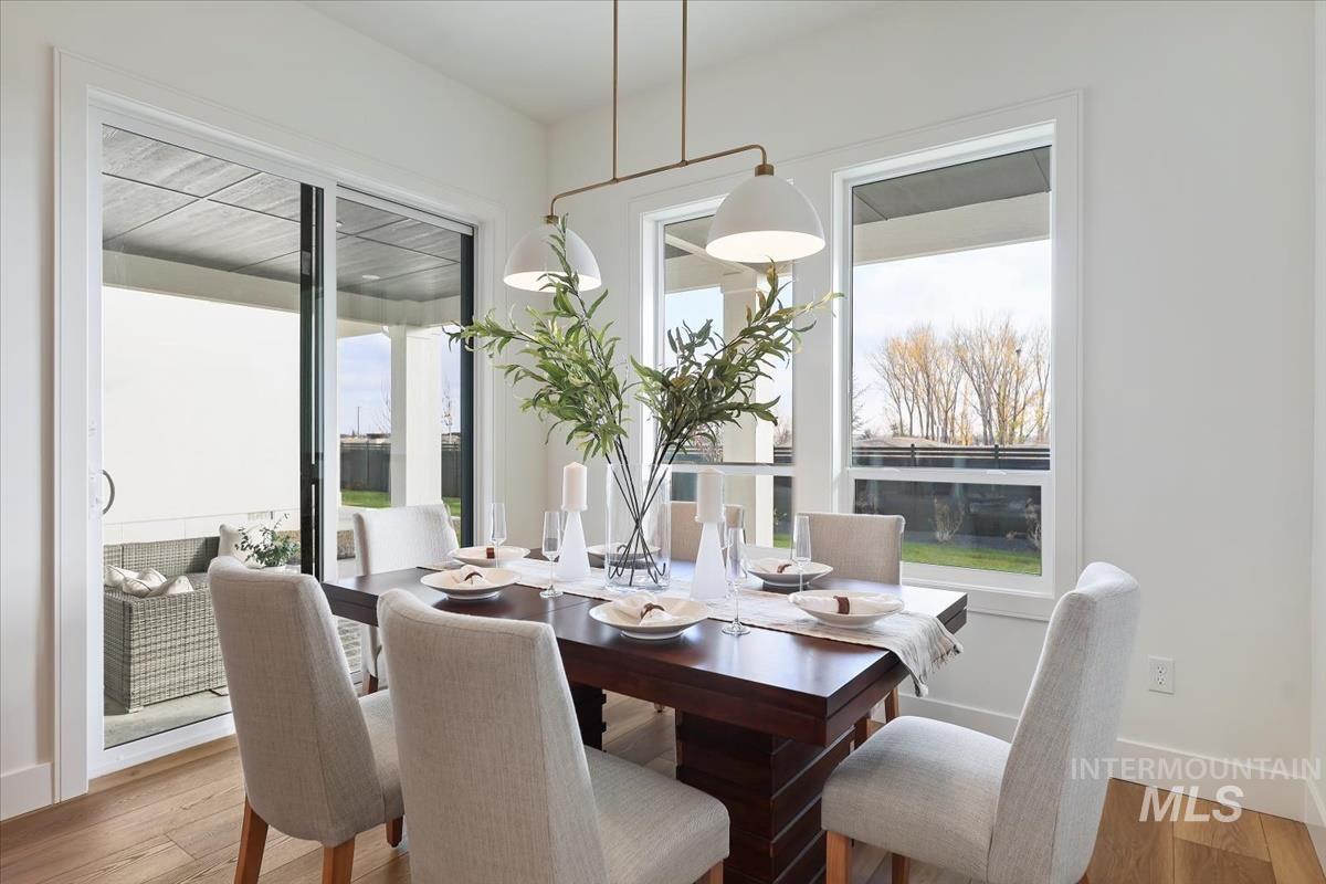 Dining space with light wood-style flooring
