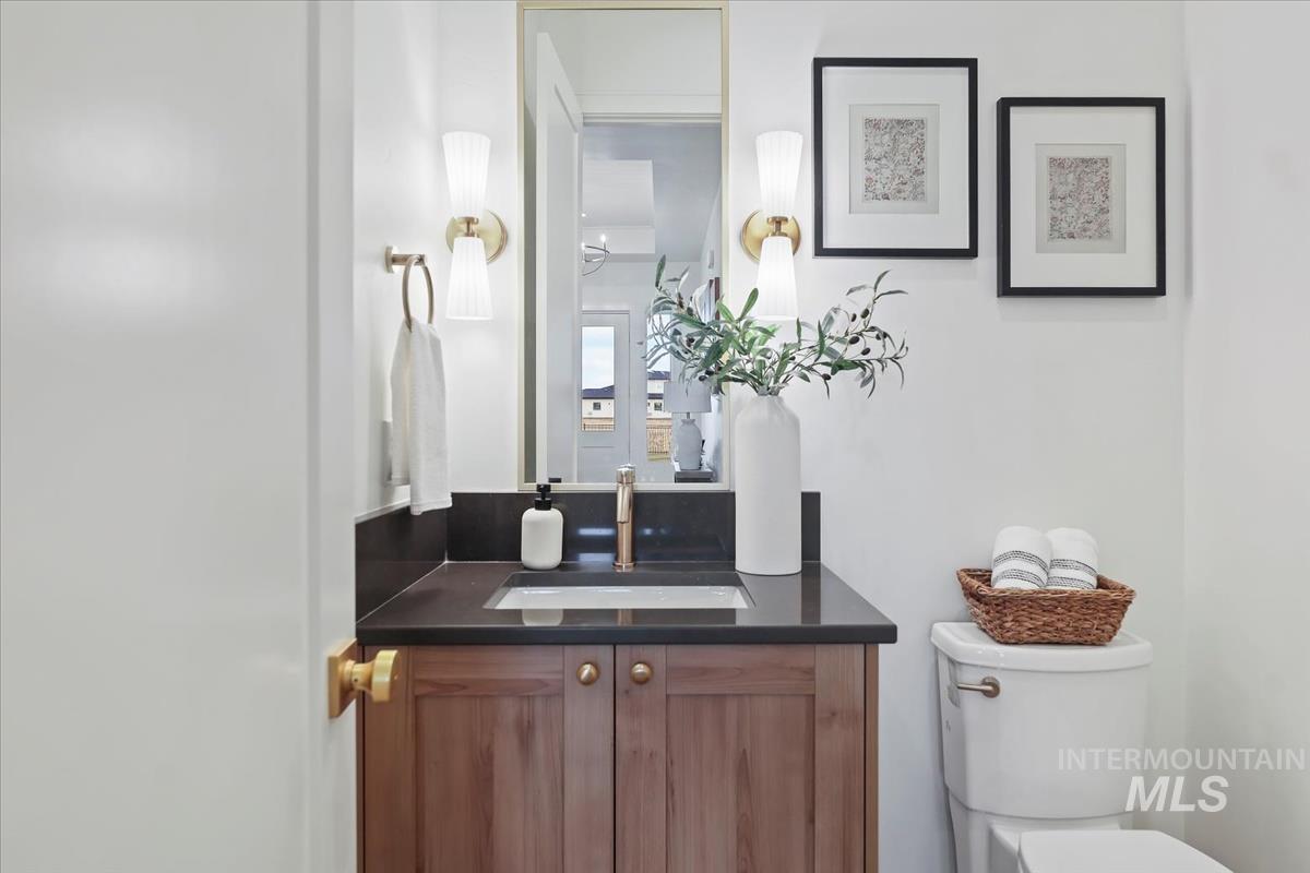 Half bath with vanity and toilet