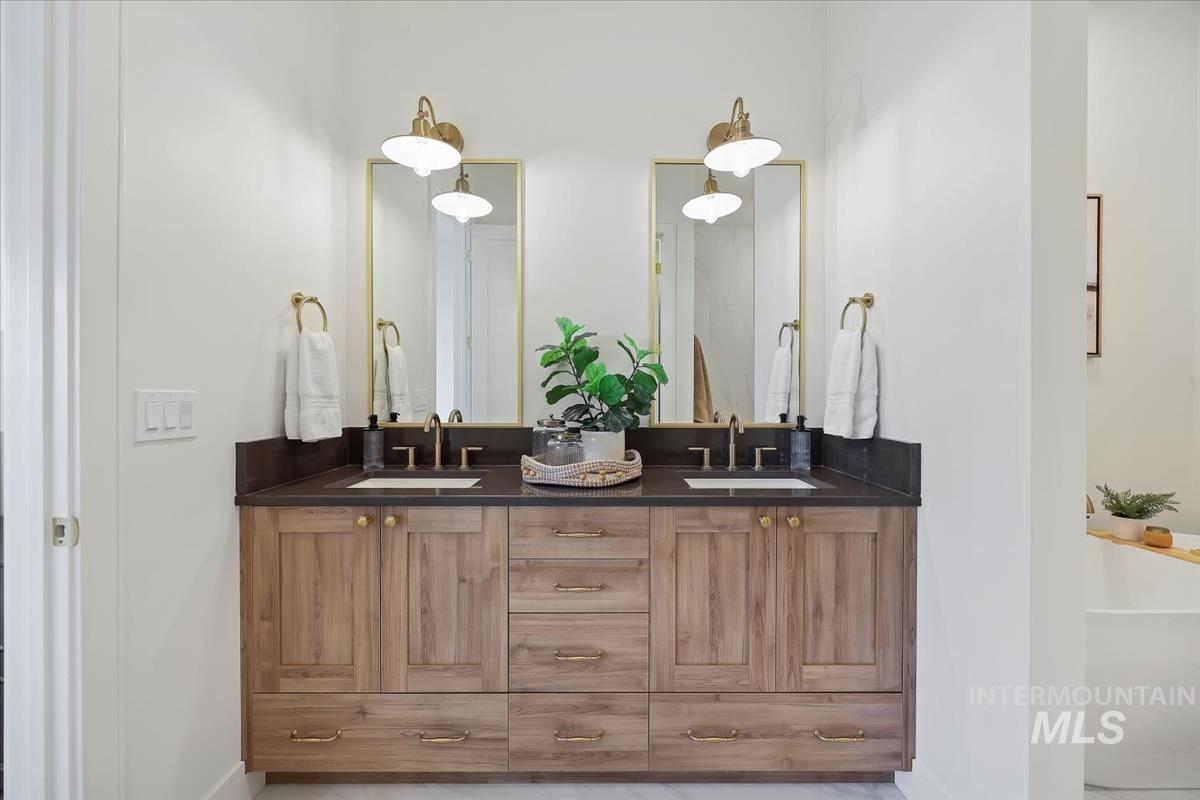 Bathroom with double vanity and a soaking tub