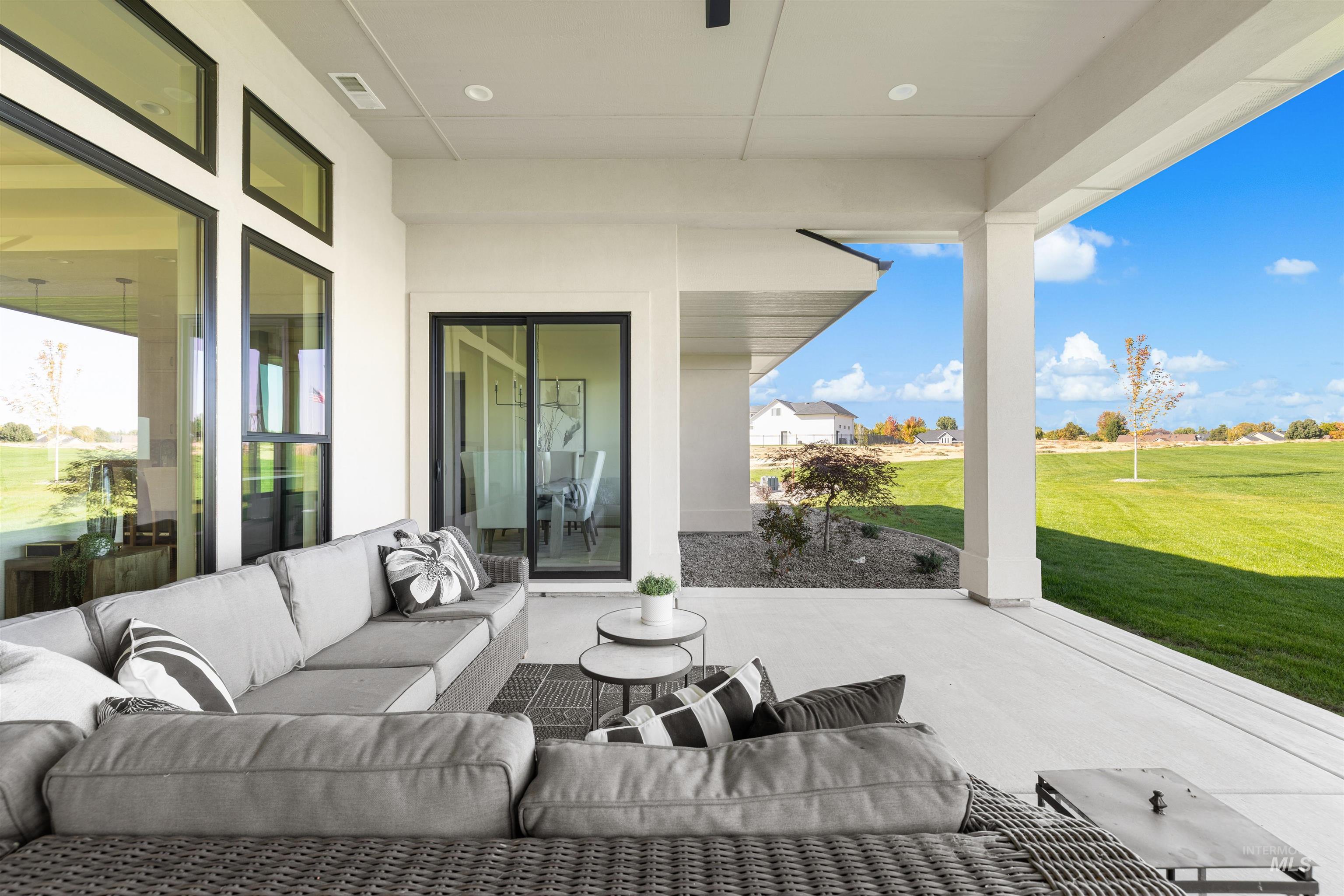 View of patio with an outdoor hangout area