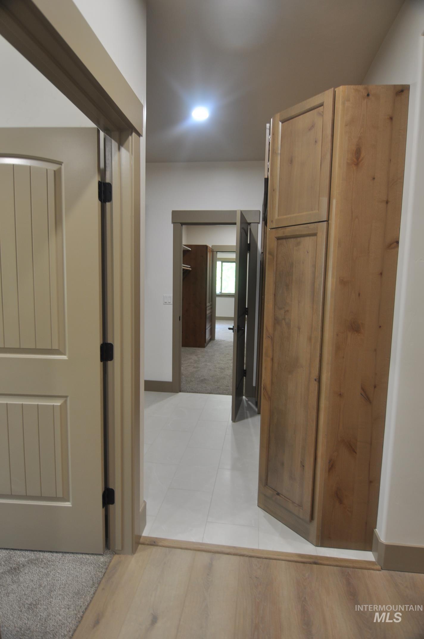 Accessed off the garage is this great mudroom with alder storage bench and cabinet and full laundry with utility sink.