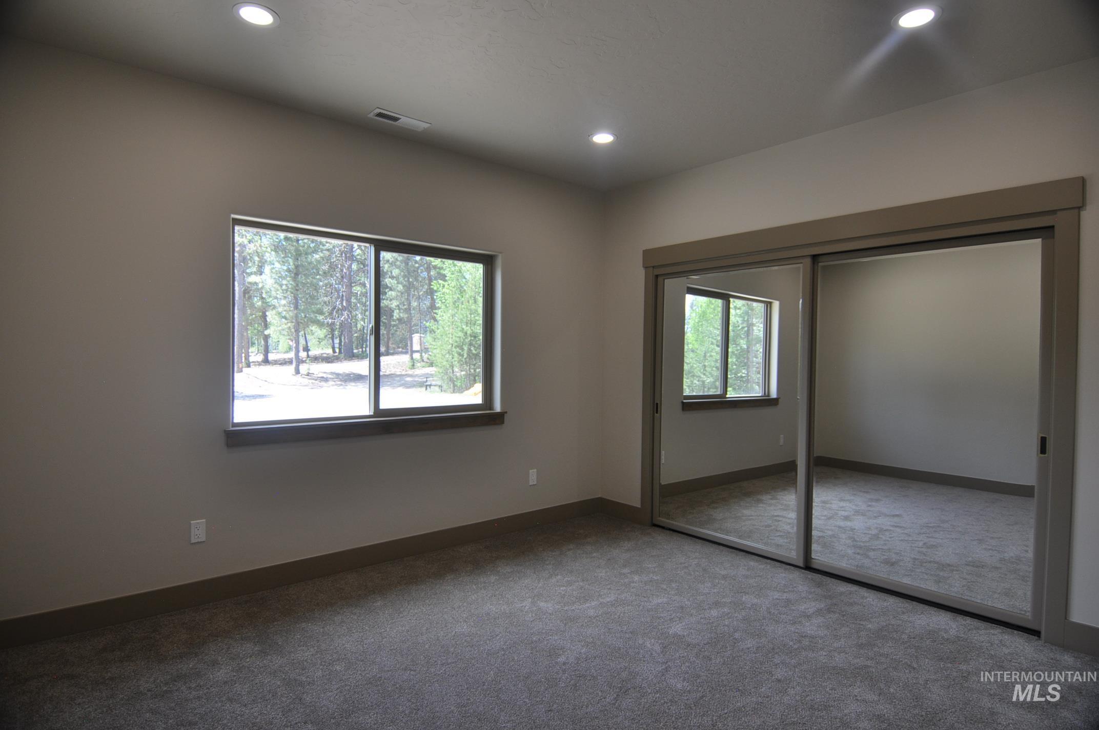 3rd bedroom is accessed from the hallway off the living room and shares a full four piece bath with the 4th bedroom. This is a large bedroom with room for a king size bed or a couple of bunk beds.