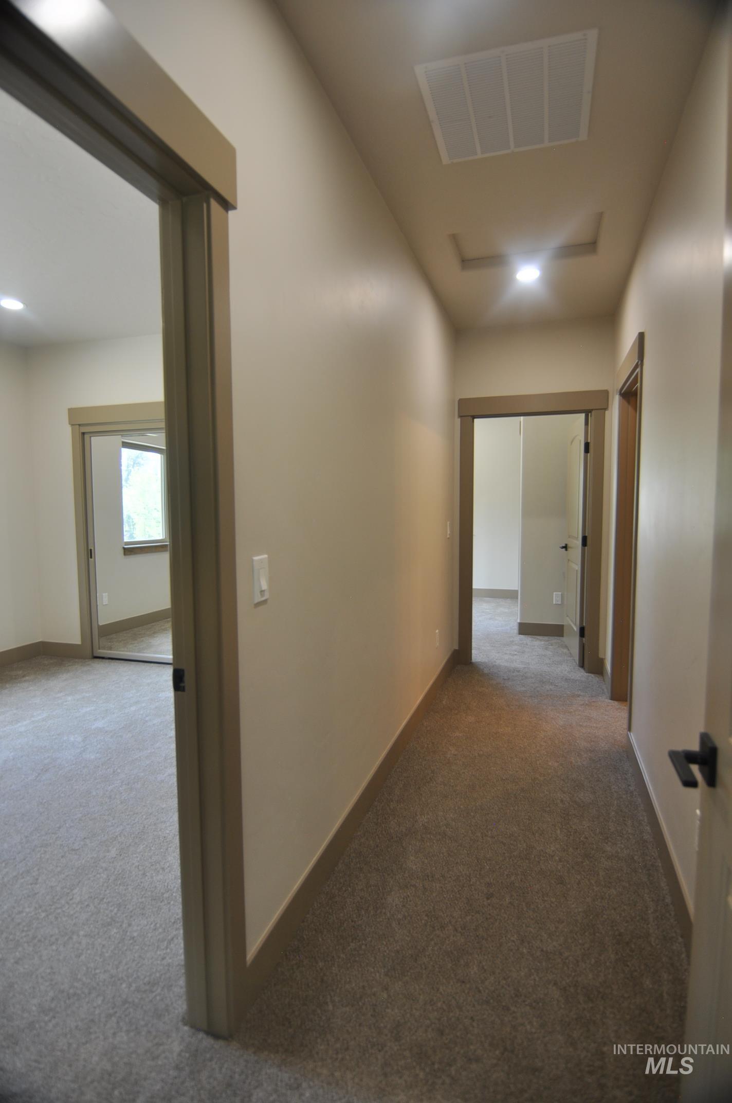 Hallway off the living room accesses two large bedrooms and a full bath. Door to living room area can be closed for privacy and quiet.