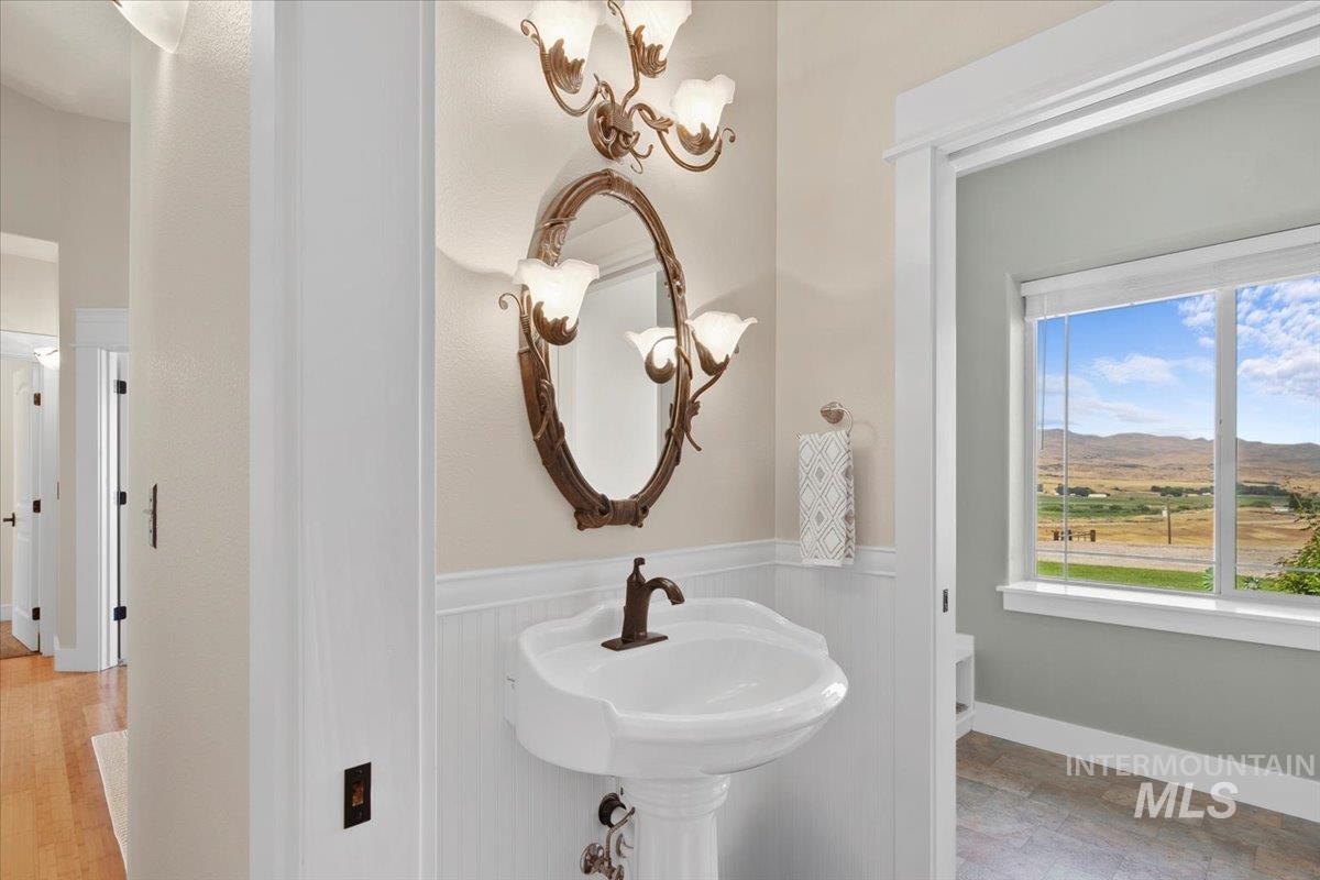 Bathroom with a mountain view and wainscoting
