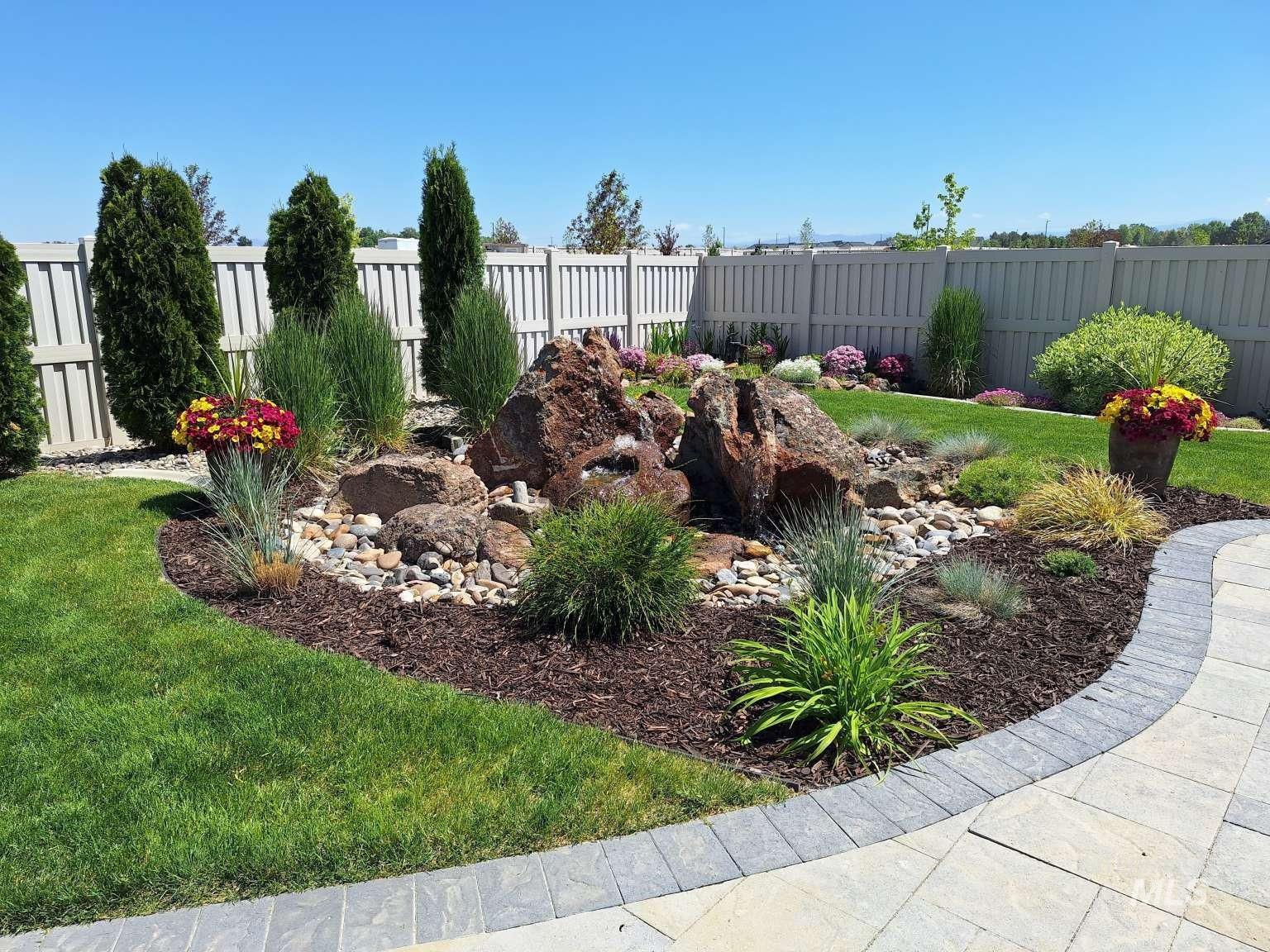 View of fenced backyard