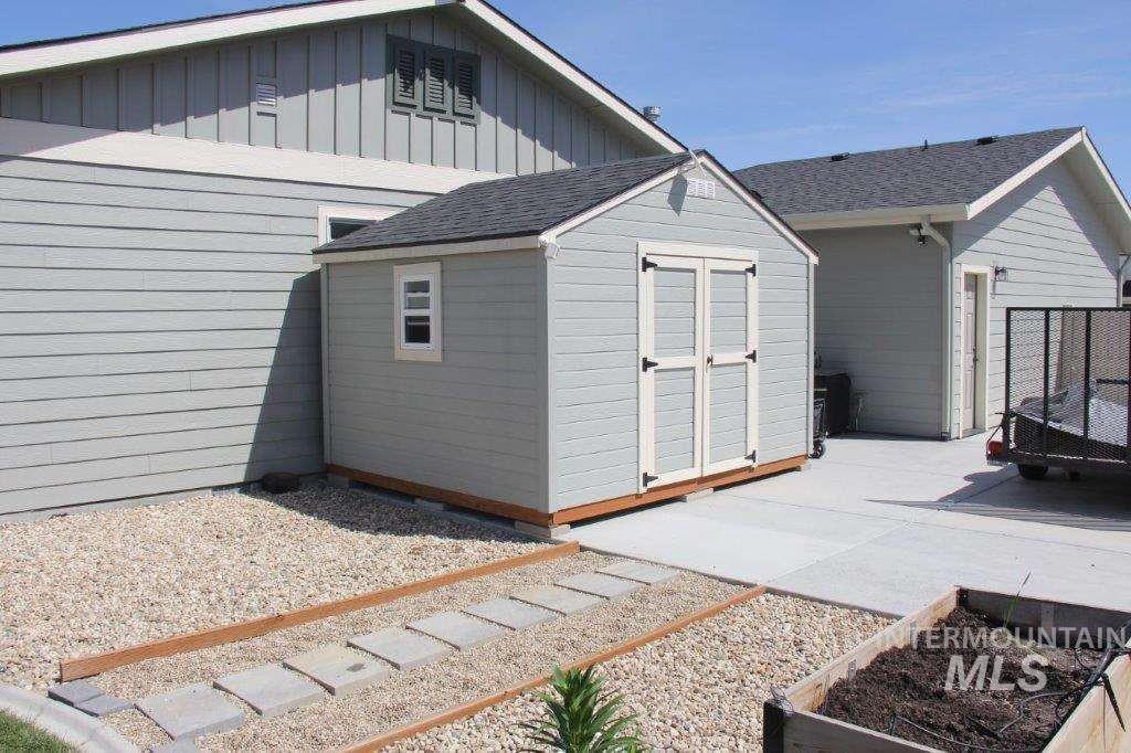 View of shed featuring a garden
