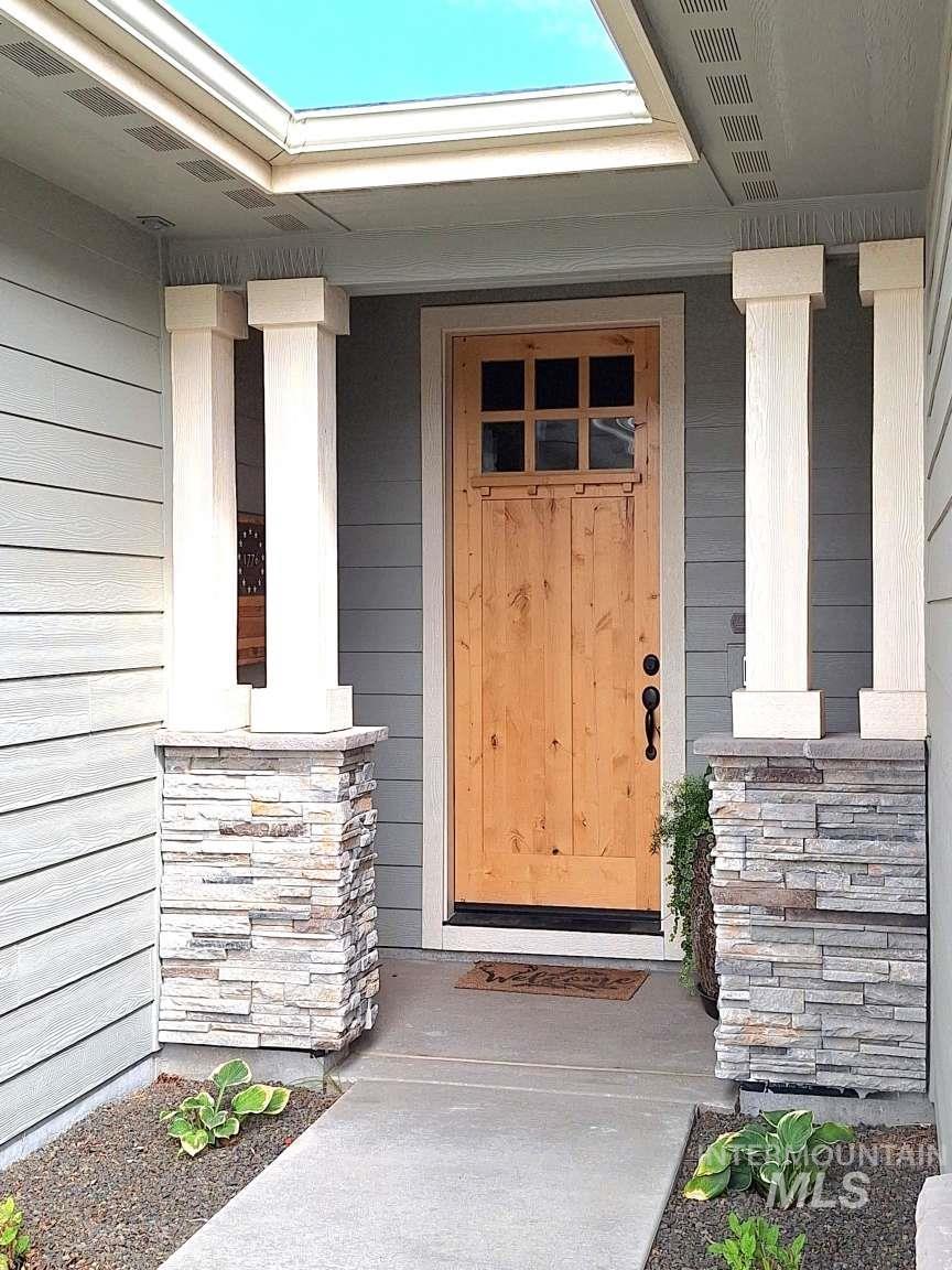 Entrance to property with covered porch