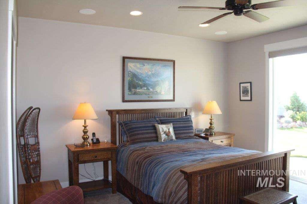 Bedroom featuring recessed lighting, ceiling fan, and access to outside