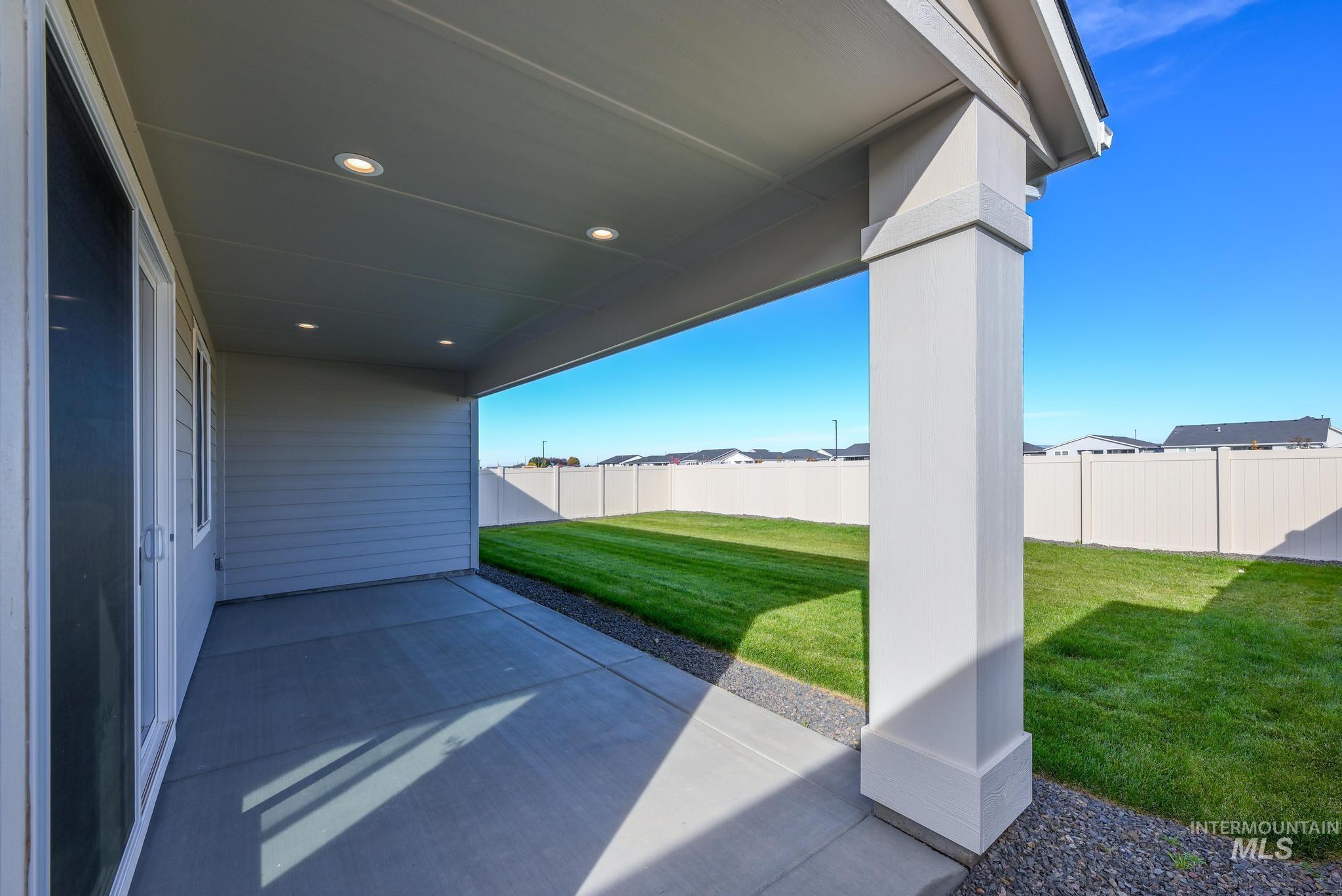 Fenced backyard featuring a patio area