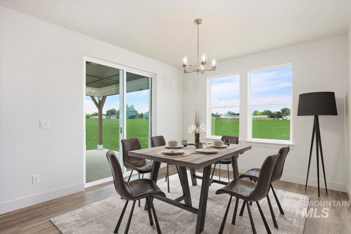 Dining room featuring a chandelier and light wood-style floors