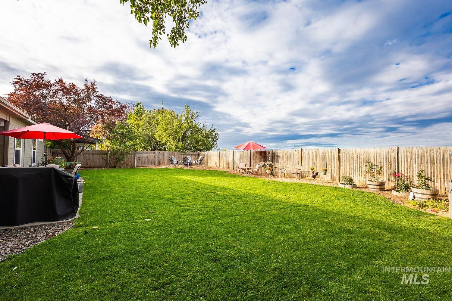 Fenced backyard featuring a patio area