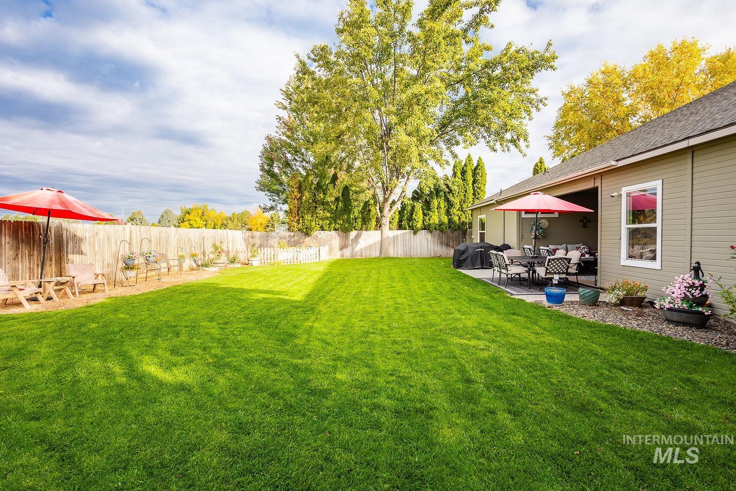 Fenced backyard with a patio