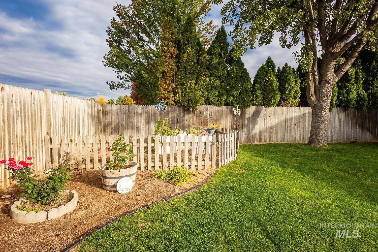 View of fenced backyard