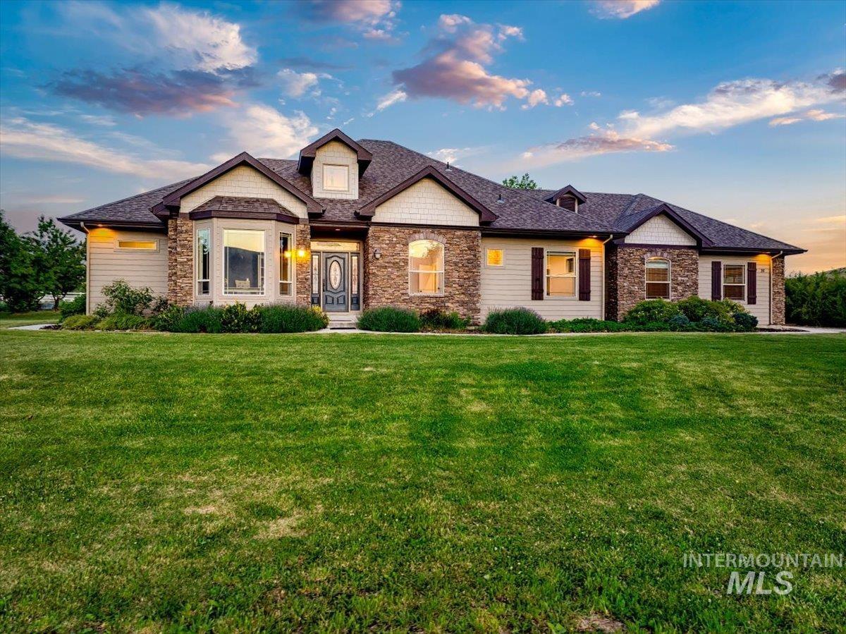 Lighting all around on photo cell, the sidewalk extends around the entire home. This home stays green most of the year and is fulling irrigated using the 2 water rights that come with the home.
