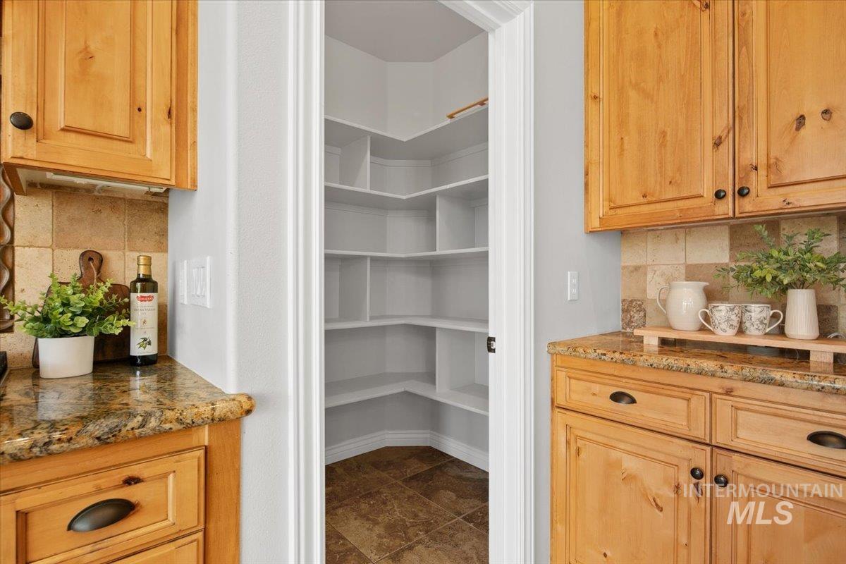 Deep pantry with plenty of shelving.