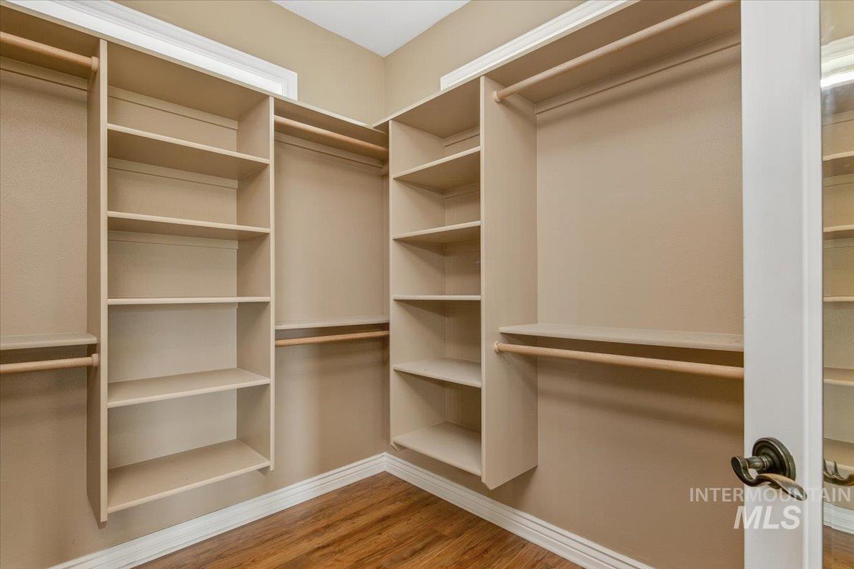 Spacious closet with light wood-style floors