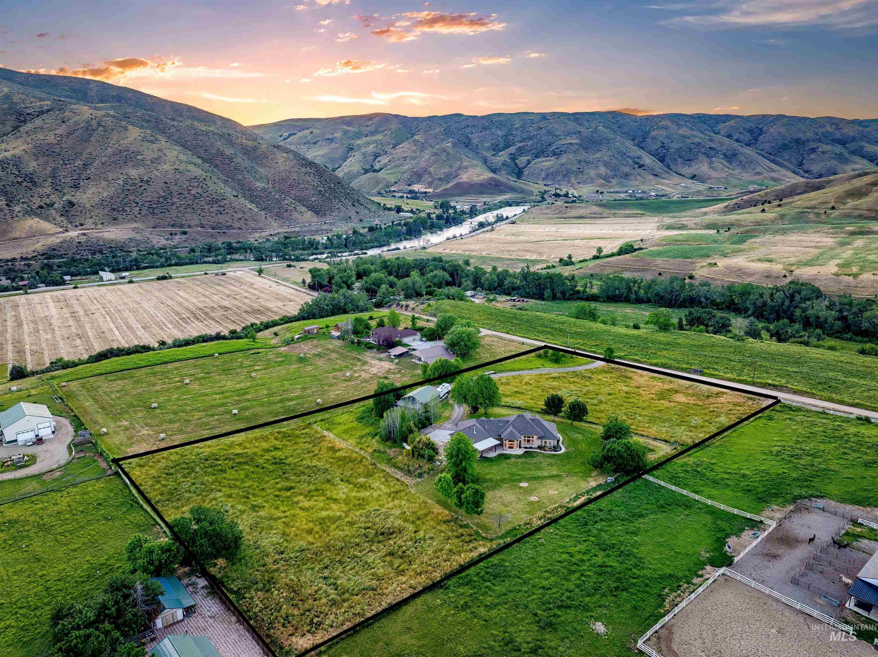 View of rural area with property parcel outlined and a mountain backdrop