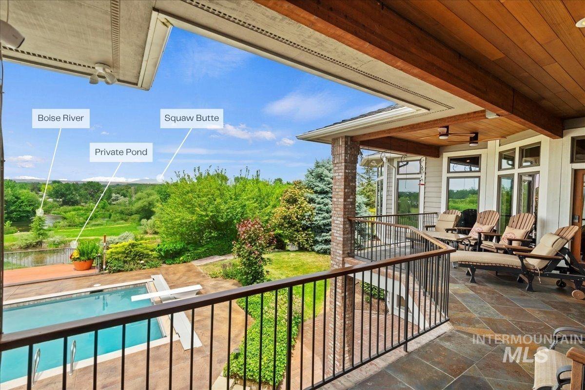 Balcony featuring view of pool