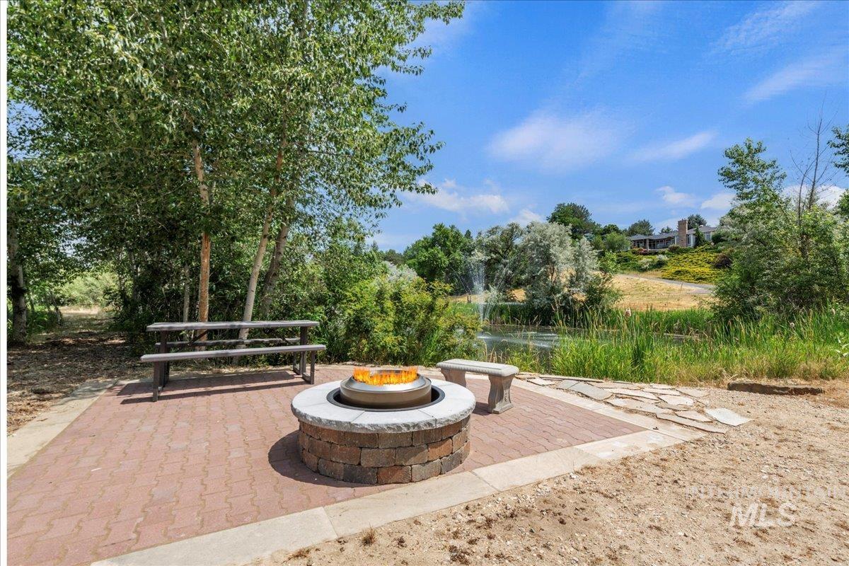 View of patio / terrace with a fire pit
