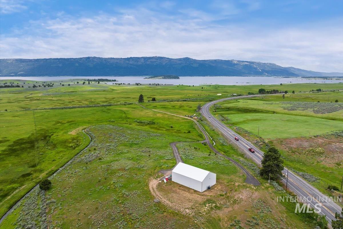 Aerial view of property's location featuring a water and mountain view and rural landscape